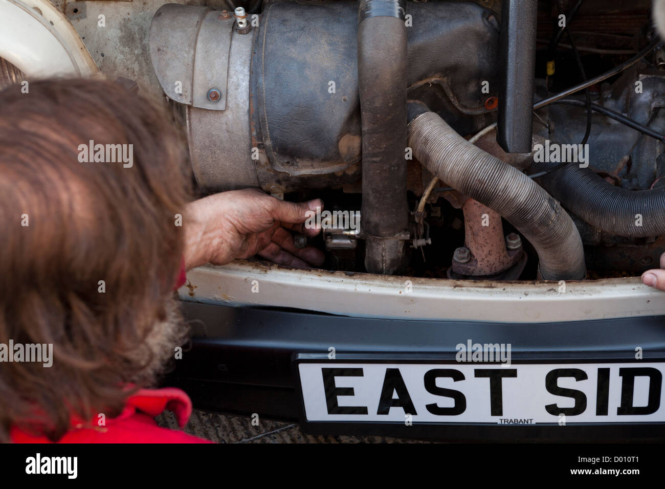 Man repairing an old Trabant car Stock Photo
