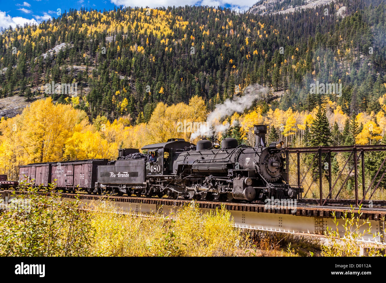 1925 2-8-2 Mikado type Baldwin Steam Locomotive pulling historic mixed consist train at Twin Bridges on the D&SNG Railroad in Colorado. Stock Photo