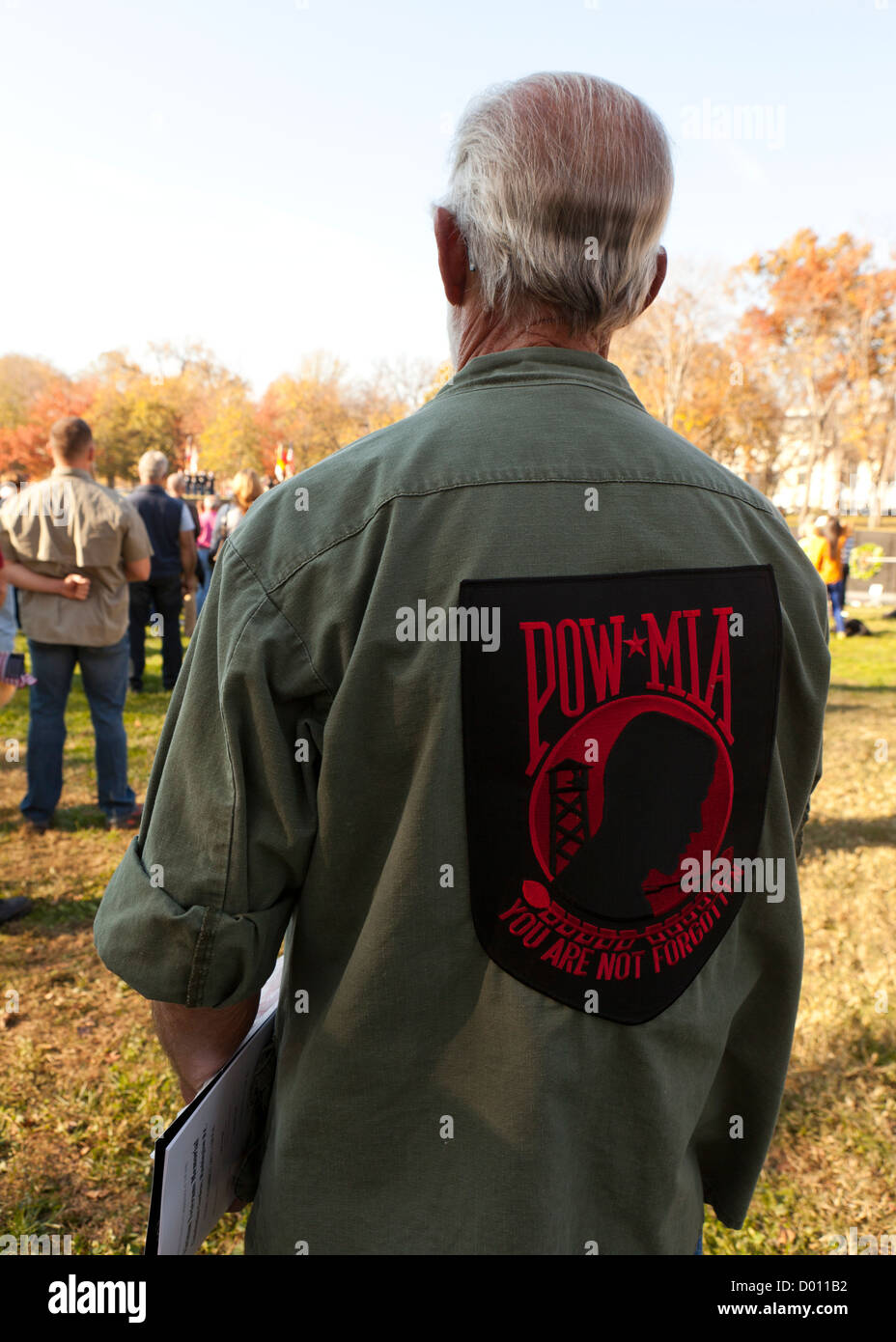 Vietnam war veteran wearing military fatigues with a large POW MIA patch Stock Photo