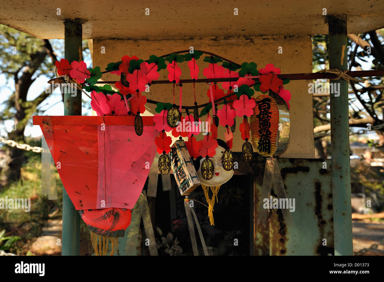 Good luck charms hanging in a small informal woodland shrine at Miho no Matsubara, Suruga Bay, Japan Stock Photo