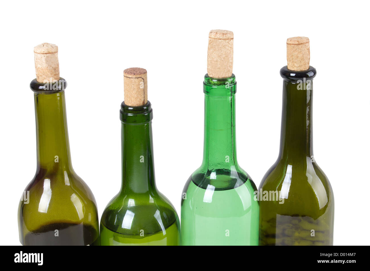 Four wine bottles isolated on white background Stock Photo - Alamy