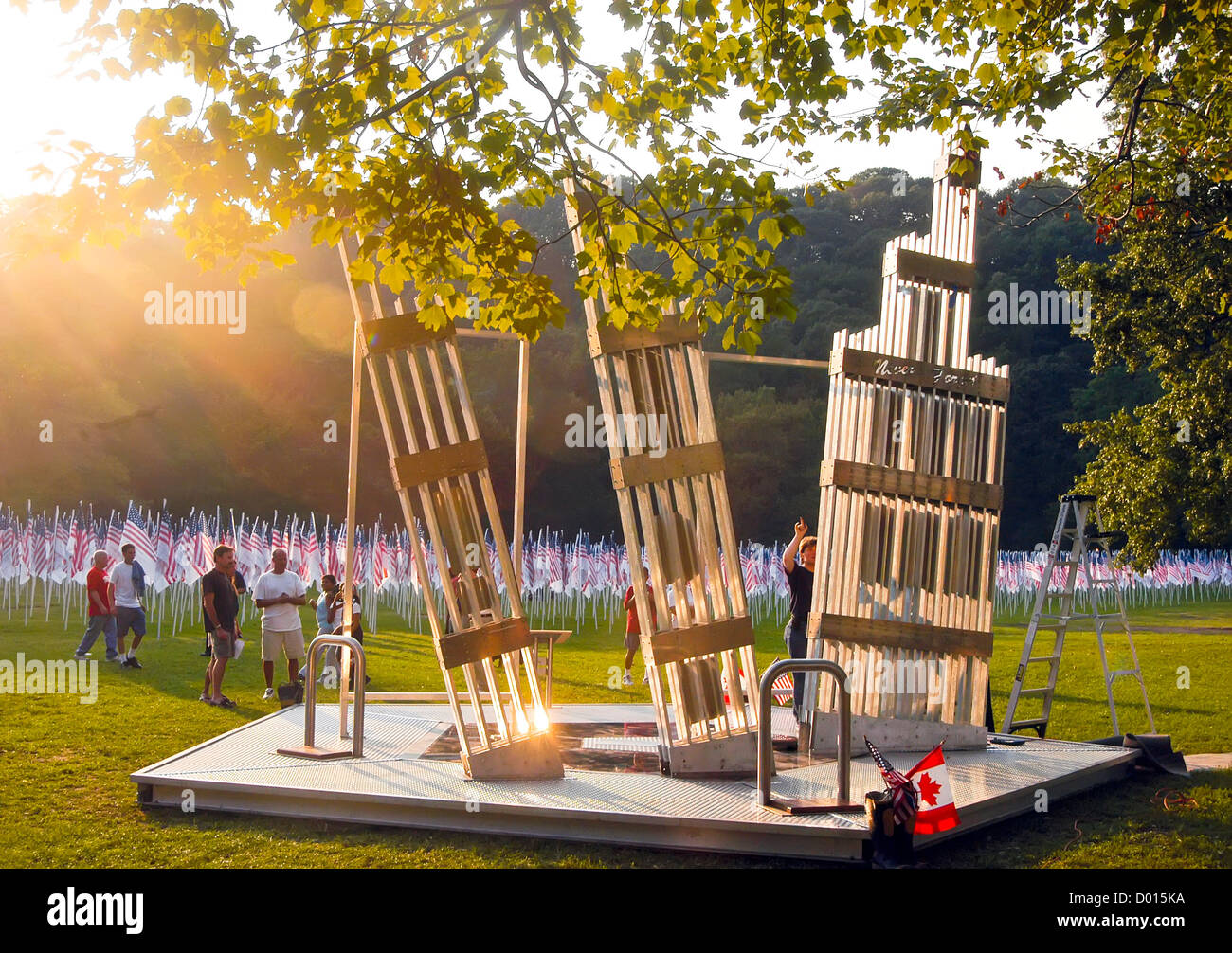 "Release of Souls" a 911 memorial sculpture surrounded by  "3000 Flags of Heroes" in memory of those who died in  WTC Stock Photo