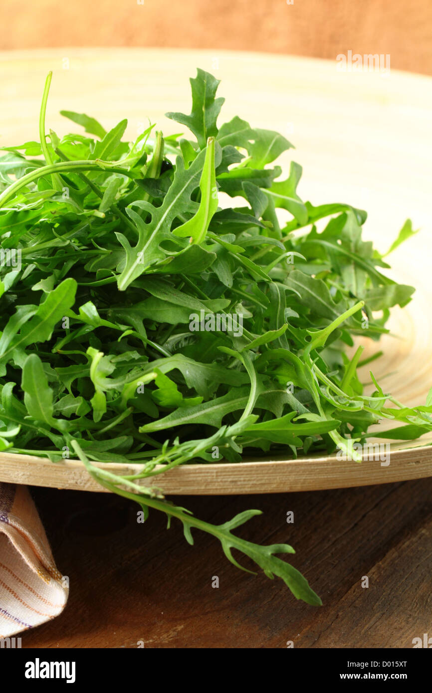 bowl of fresh green, natural arugula Stock Photo
