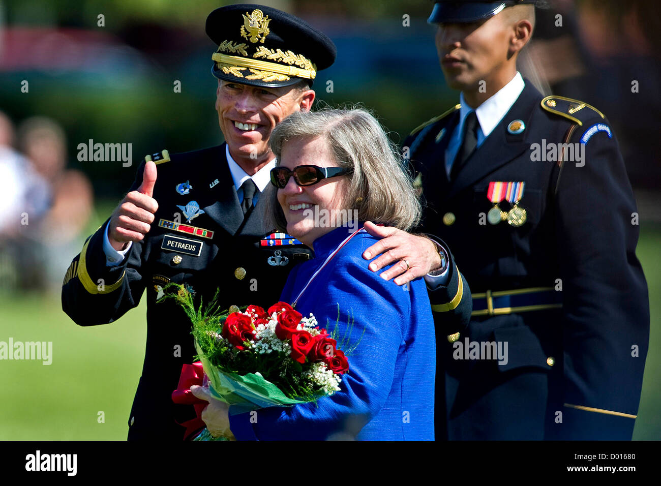 110831-N-TT977-123 U.S. Army Gen. David H. Petraeus gives the thumbs up with his wfe Holly at his retirement ceremony and Armed Stock Photo