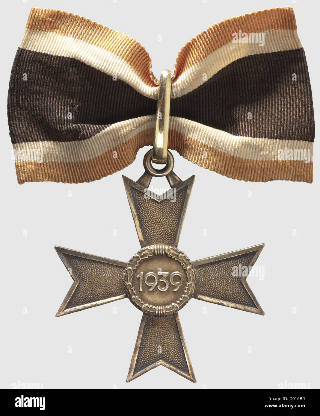A Knight's Cross of the War Merit Cross of 1939 in Gold,Gold-plated silver,the edges and raised areas polished.Smooth,closed suspension ring,the lower cross-arm punched '900' and '20'(for Zimmermann,Pforzheim).Typical shallow,roughly de-burred Zimmermann issue.Dimensions ca.53 x 59.8 mm,weight 30.5 g.With a ribbon segment ca.80 mm in length(Nie 7.04.01).The gold class was instituted on 8 July 1944 and only produced in very small numbers.Just two bestowals are known to have occurred.This example comes from the awards hoard hidden by the Orders ,Additional-Rights-Clearences-Not Available Stock Photo