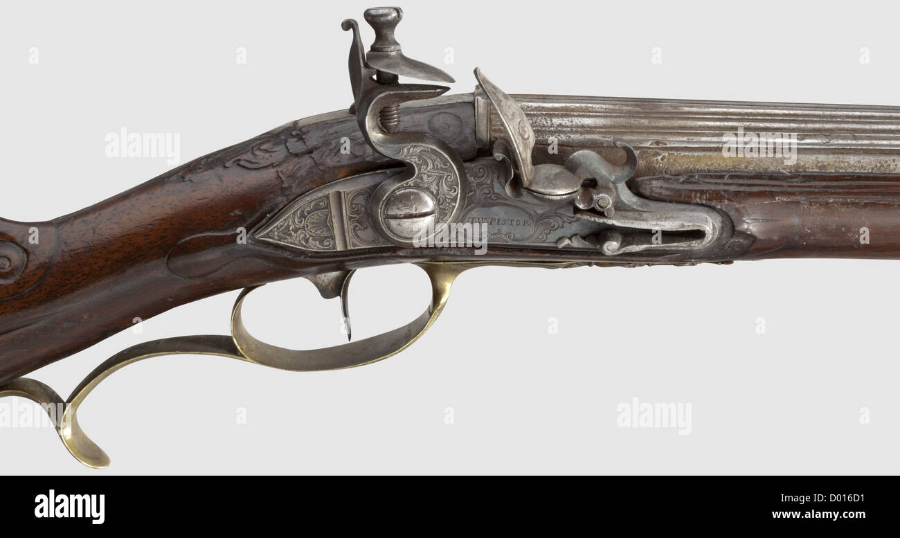 A German flintlock shotgun,Thomas Wilhelm Pistor of Schmalkalden,circa 1760. Two-stage fluted barrel,round after a baluster,with smooth bore in 14.5 mm calibre. Lavishly engraved flintlock,upper jaw replaced,repairs to the pan and frizzen area. Walnut Catalan full stock with Rocaille-decorated brass furniture. Repaired breaks and cracks,repeatedly supplemented and reworked. Wooden ramrod with brass tip. Length 118 cm,historic,historical,18th century,civil long guns,gun,weapons,arms,weapon,arm,firearm,fire arm,gun,fire arms,firearms,guns,o,Additional-Rights-Clearences-Not Available Stock Photo