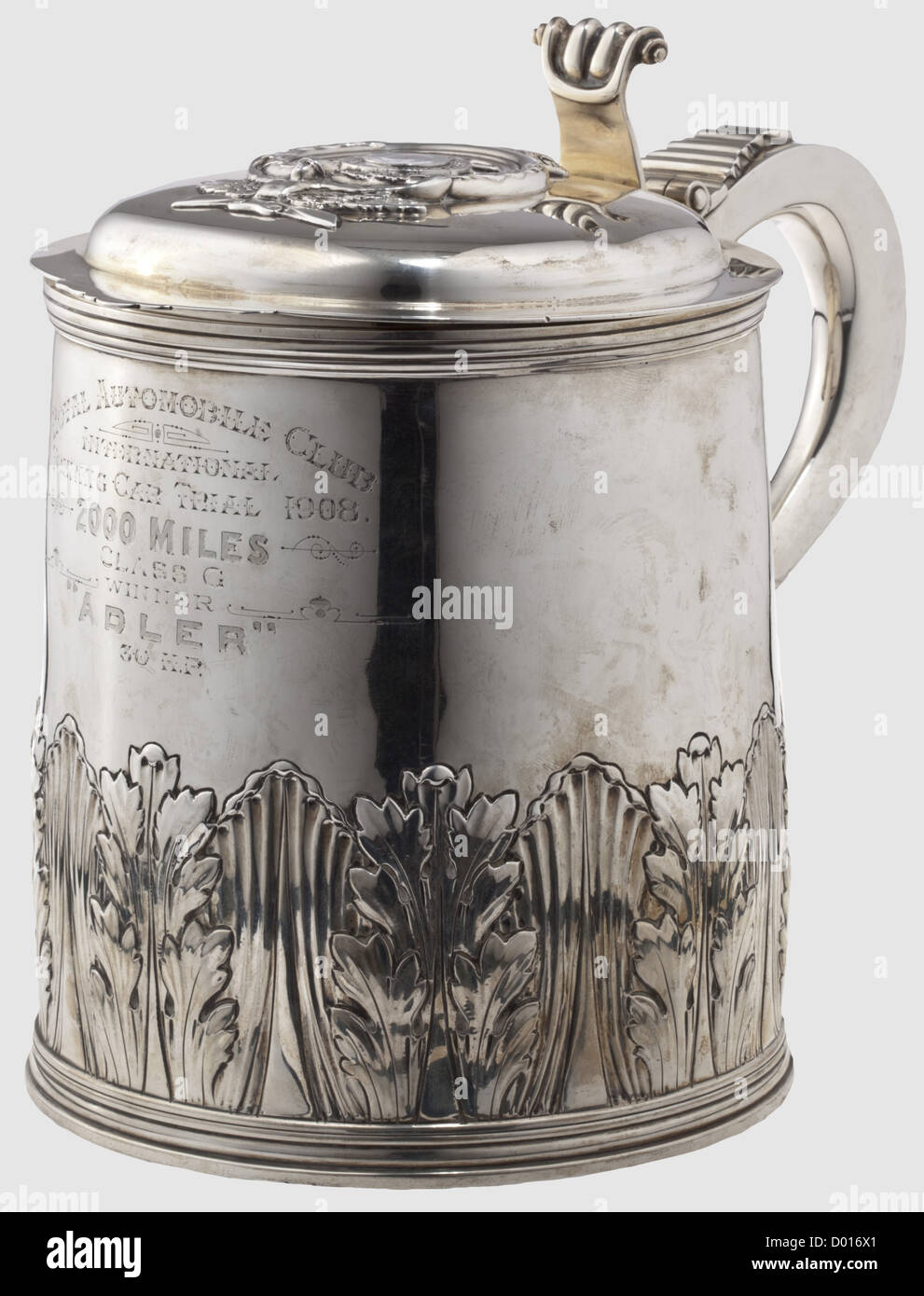 A racing prize in the form of a silver tankard,England,dated 1908. Chased silver with a dedication engraved on the front 'Royal Automobile Club- International Touring Car Trial 1908. 2000 Miles - Class G,Winner 'Adler' 30 H.P.' The sides bear English hallmarks and the master's mark 'E & Co.' The emblem of the Royal Automobile Club shown on the lid in relief. Height 24.5 cm. Weight 1,875 g. Provenance: From the legacy of the German race driver,H. Wilhelm,historic,historical,1900s,20th century,vessel,vessels,object,objects,stills,clipping,clippings,Additional-Rights-Clearences-Not Available Stock Photo