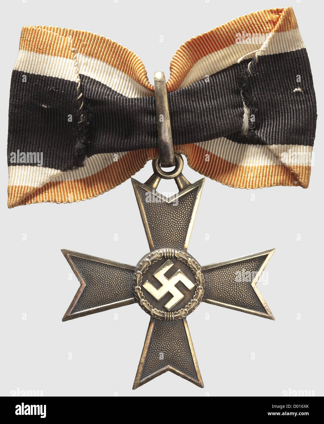 A Knight's Cross of the War Merit Cross of 1939 in Gold,Gold-plated silver,the edges and raised areas polished.Smooth,closed suspension ring,the lower cross-arm punched '900' and '20'(for Zimmermann,Pforzheim).Typical shallow,roughly de-burred Zimmermann issue.Dimensions ca.53 x 59.8 mm,weight 30.5 g.With a ribbon segment ca.80 mm in length(Nie 7.04.01).The gold class was instituted on 8 July 1944 and only produced in very small numbers.Just two bestowals are known to have occurred.This example comes from the awards hoard hidden by the Orders ,Additional-Rights-Clearences-Not Available Stock Photo