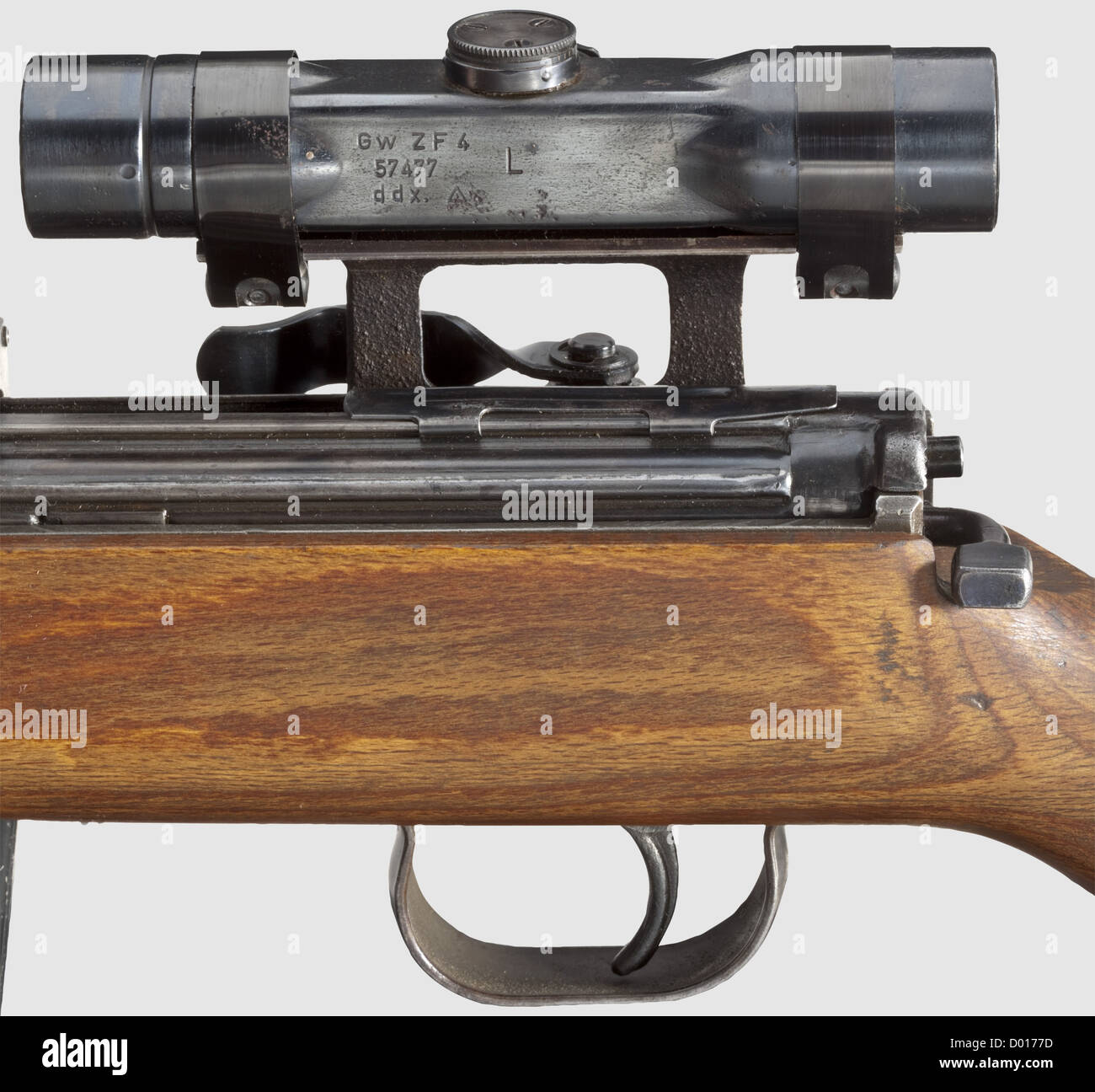 A self-loading rifle G 43,code 'ac 44' with scope ZF 4,cal.8 x 57,no.2159n.Matching numbers.Bright bore.Produced in 1944 at Walther's in Zella-Mehlis.Various acceptance marks eagle/'359'.Ten shots.Dust cover.Large,correct hooded sight.Original finish in a light patina,few wear marks.Matching-numbered laminated stock with cleaning rod.Magazine coded 'gcb'.Mounted: original,re-finished scope ZF 4,marked 'Gw ZF 4 / 57477 / ddx',beside it 'L' for Luftwaffe.Reticule 1.Without protection cap for windage.Technically and optically in good order.,Additional-Rights-Clearences-Not Available Stock Photo