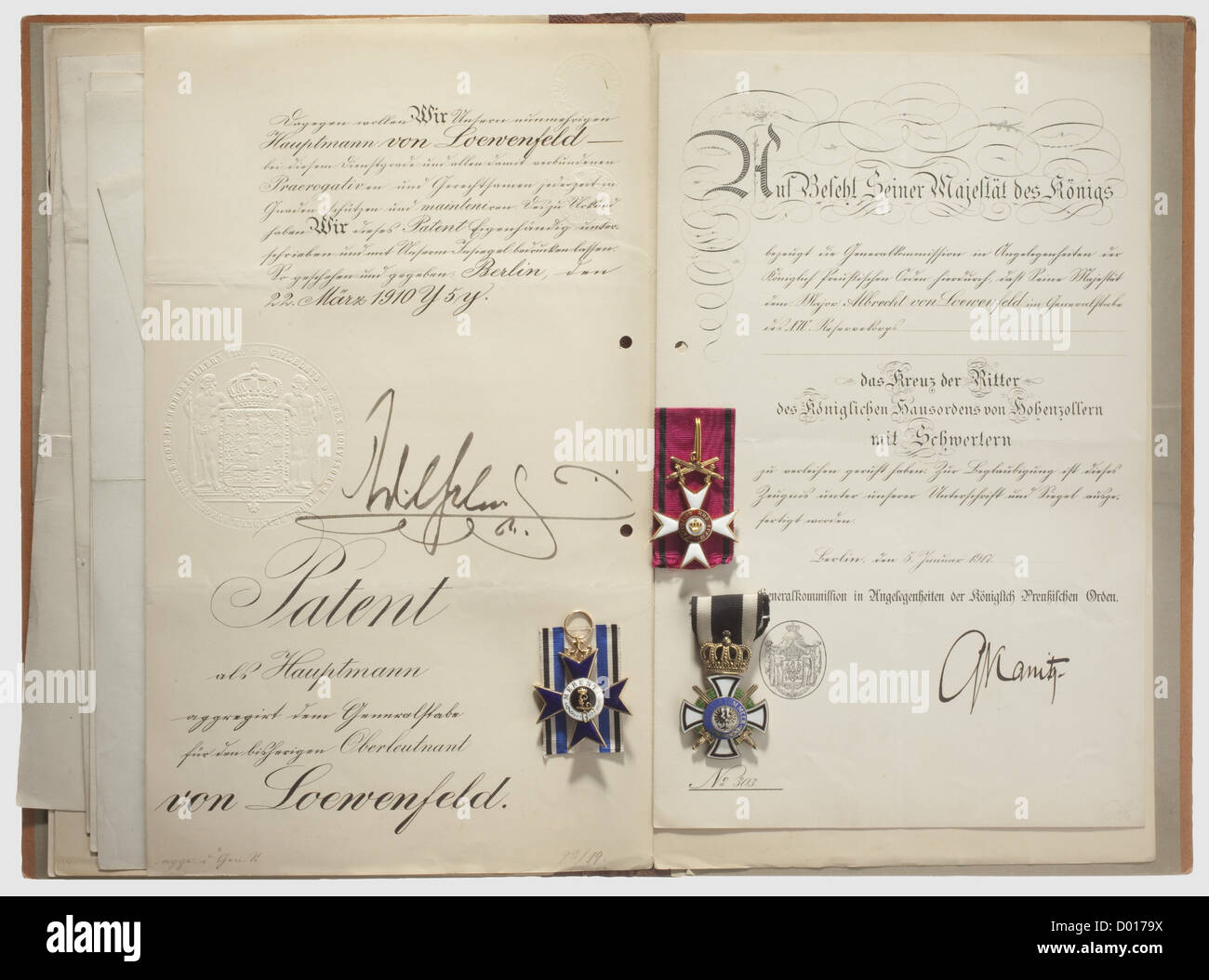 Documents and awards of Major i.G. Albrecht von Loewenfeld,PATENTS: to Cadet Officer,1895,to Second Lieutenant,1896,1st Lieutenant,1897 and to Captain i.G,1910(this with signature of Wilhelm II). Possession document for the Centenary Medal signed by von Einterfeld,Adjutant-General of the Kaiser. BAVARIA: Military Merit Order,Knight's Cross 2nd Class,gold,12.3 g,enamelled,three-piece medallion,minimal chips(OEK 415)with the award document of 1901,award document for the Military Merit Order 4th Class with Swords,1914. BADEN: Award d historic,h,Additional-Rights-Clearences-Not Available Stock Photo