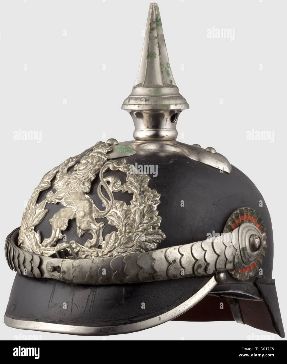 A helmet for a 'Wachtmeister',(sergeant)of Gendarmes. Same helmet pattern as for the 23rd and 24th Dragoon Regiments. Leather skull,nickel-plated mountings and convex metal chinscales on screw rosettes. Officer's pattern Hessian and Imperial cockades. Leather lining. Front peak rail loose(introduced in 1891 and put on later). Not cleaned. It comes with a large size photograph of the owner in the uniform of a Senior Sergeant of Gendarmes,historic,historical,19th century,Hesse-Darmstadt,German,Germany,weapons,arms,weapon,arm,militaria,utensil,pie,Additional-Rights-Clearences-Not Available Stock Photo