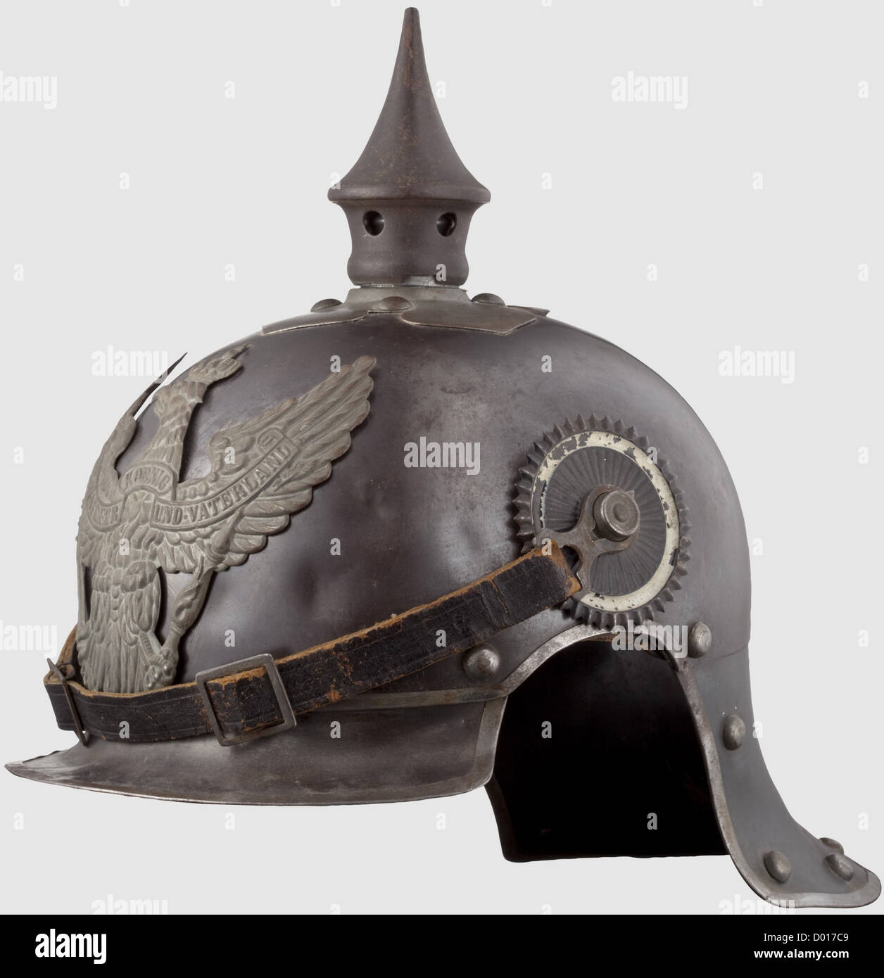 A model 1915 helmet for enlisted men,Blued steel skull with bright metal trim and rivets. Field grey spike on a bayonet mount. Field grey dragoon eagle. Leather chinstraps on '91' buttons. Enlisted men's cockades. Leather lining. The maker's inscription 'Weissenburger & Cie Cannstatt' is inside at the top,historic,historical,1910s,20th century,Prussian,Prussia,German,Germany,militaria,military,object,objects,stills,clipping,clippings,cut out,cut-out,cut-outs,helmet,helmets,headgear,headgears,protection,protective,uniform,uniforms,ute,Additional-Rights-Clearences-Not Available Stock Photo