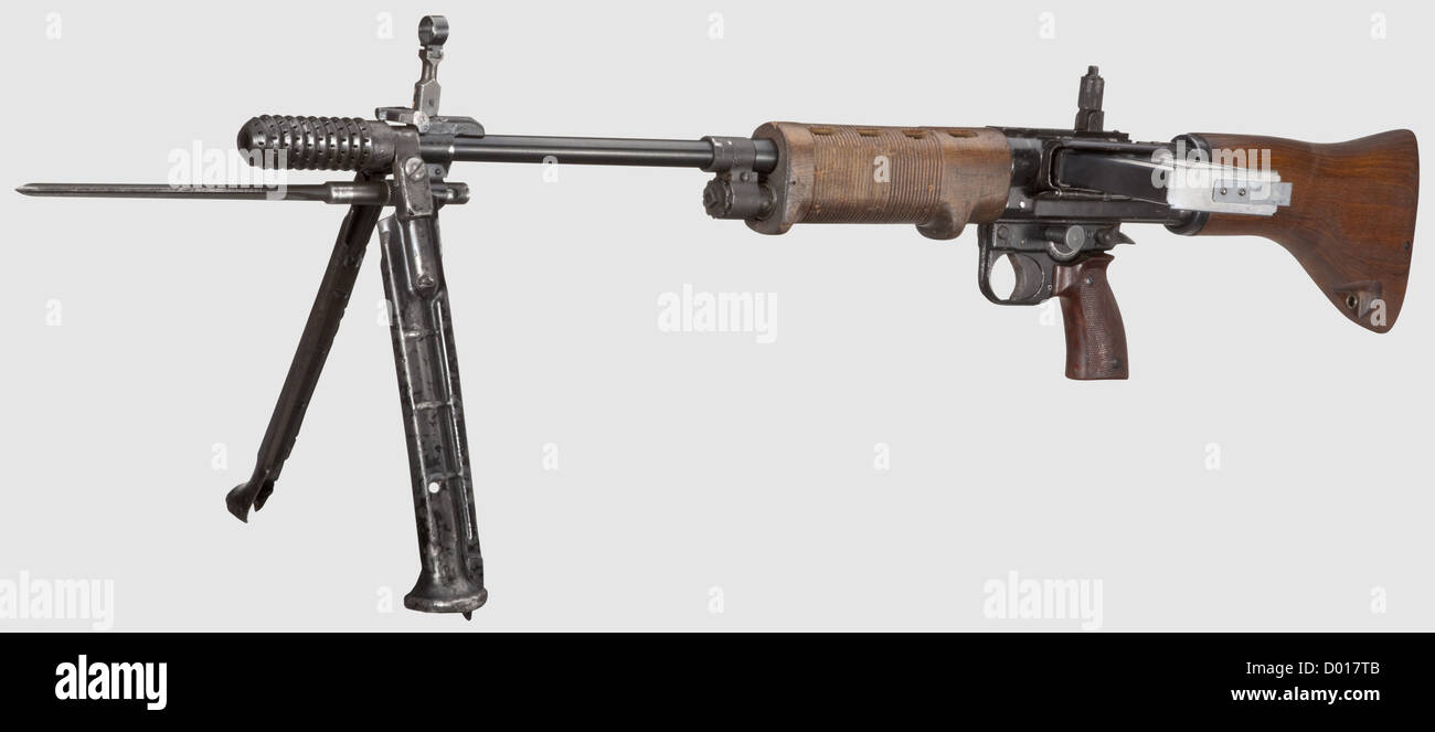 An original Fallschirmjägergewehr 42(FG 42),late model,coded 'fzs',Cal. 8 x 57,no. 01349. Bright bore,barrel length 500 mm. Combination flash damper / muzzle brake. Ring and bead sight scaled 1 - 12. On the housing marked 'fzs / FG 42 / 01349',i. e. manufactured by Heinrich Krieghoff Co,Suhl. Fully automatic gas-operated rifle with locked breech,for both single and continuous fire. Sheet steel-stamped. Housing with dove tailed rail for ZFG 42. Foldable bipod. Needle bayonet. Original black paint partially mended,with fine pits,spotted. Reworked barre,Additional-Rights-Clearences-Not Available Stock Photo