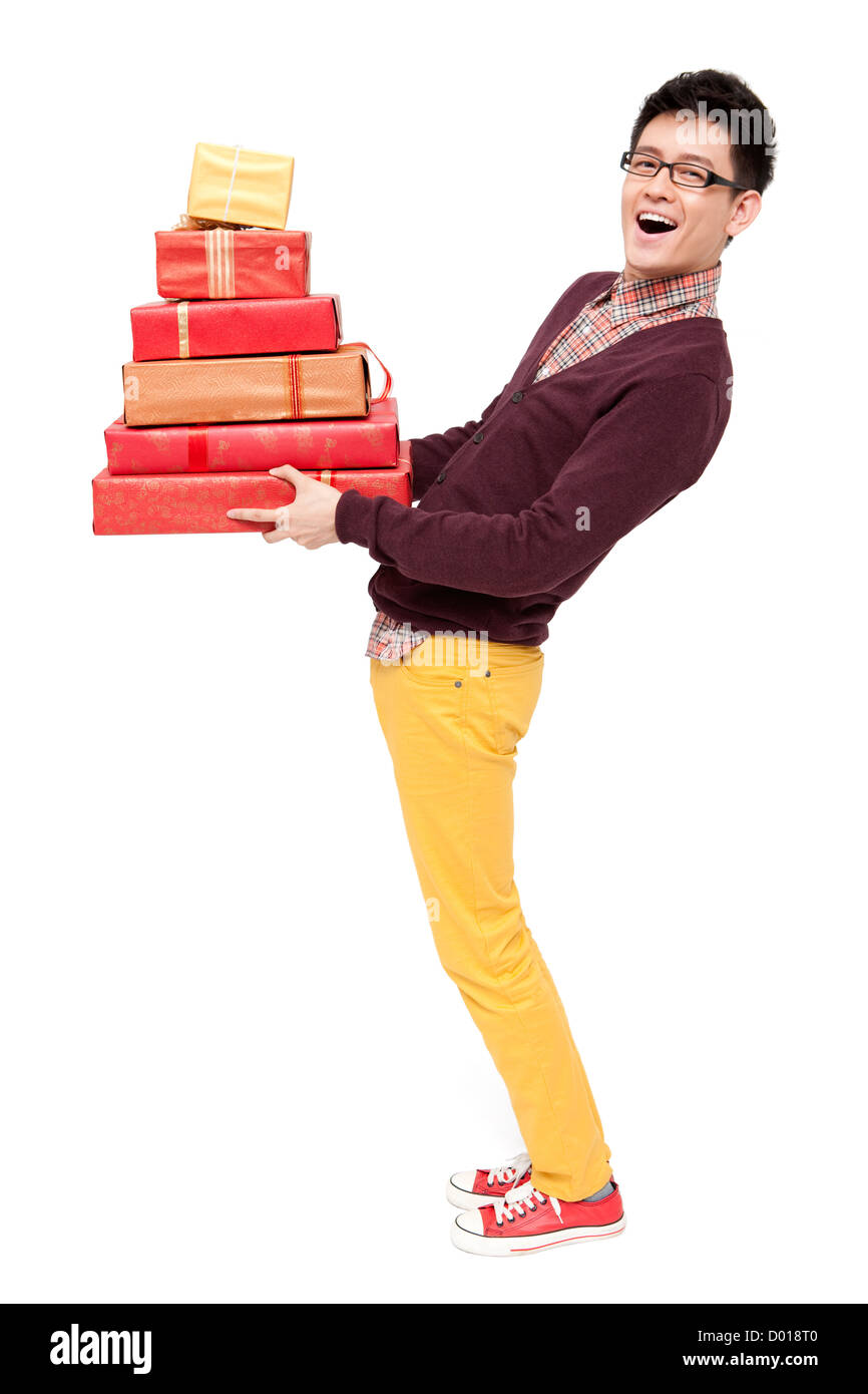 Happy young man holding gift for Chinese traditional New Year Stock Photo