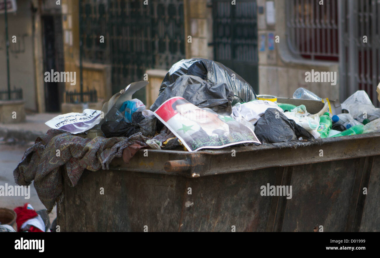 November 1, 2012 - Aleppo, Syria: A photo of Syrian President Bashar Assad sits in a trash bin. Stock Photo