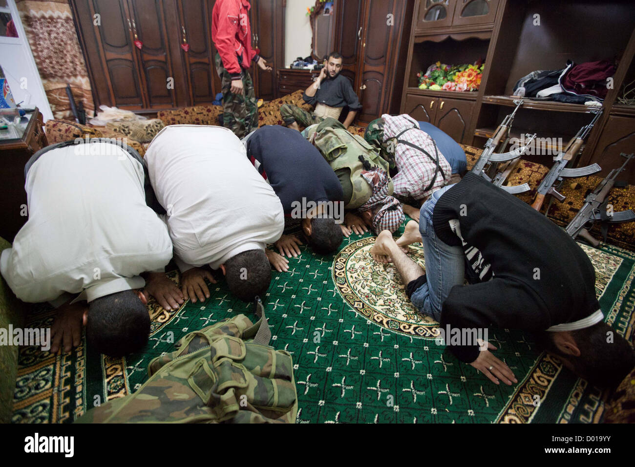 Free Syrian Army fighters take part in prayer during the Eid Al Adah. Stock Photo