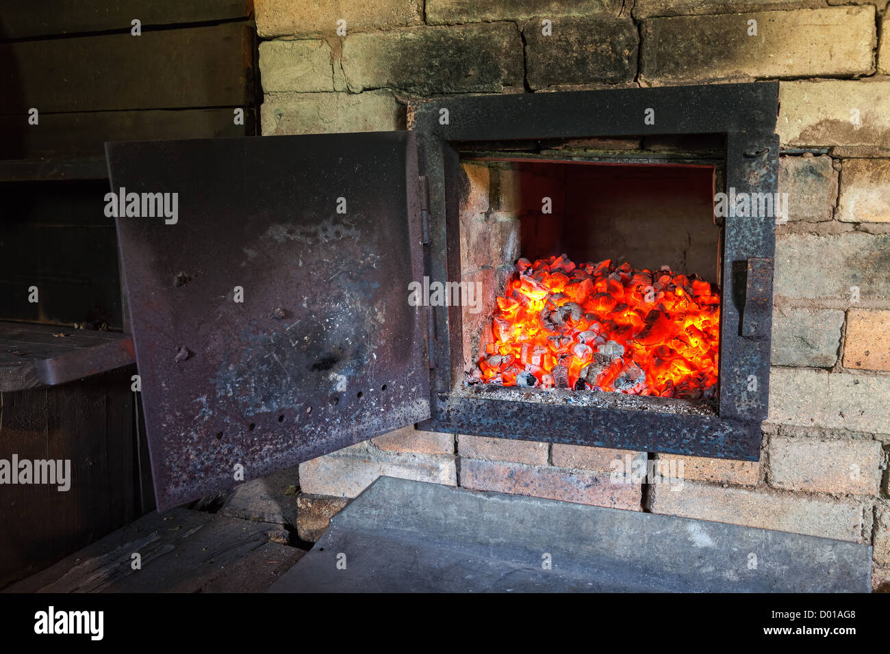 Old stove with open door and burning the wood Stock Photo Alamy
