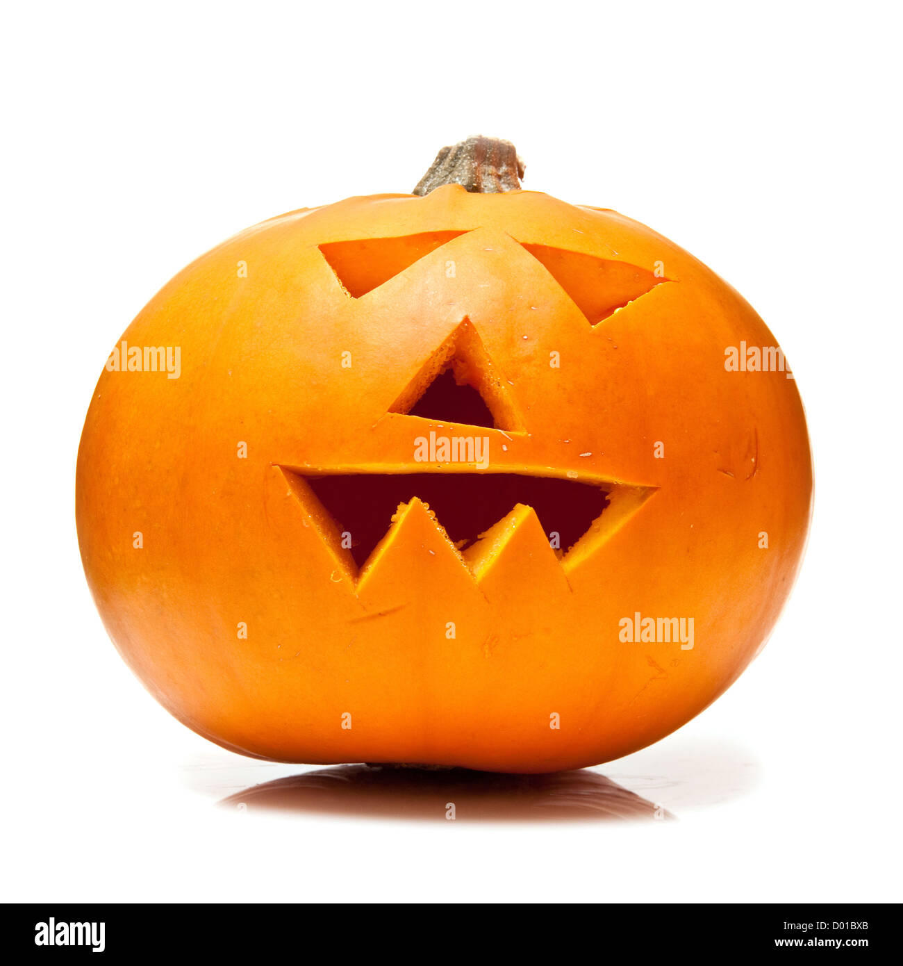 Orange carved Halloween pumpkin isolated on a white studio background ...