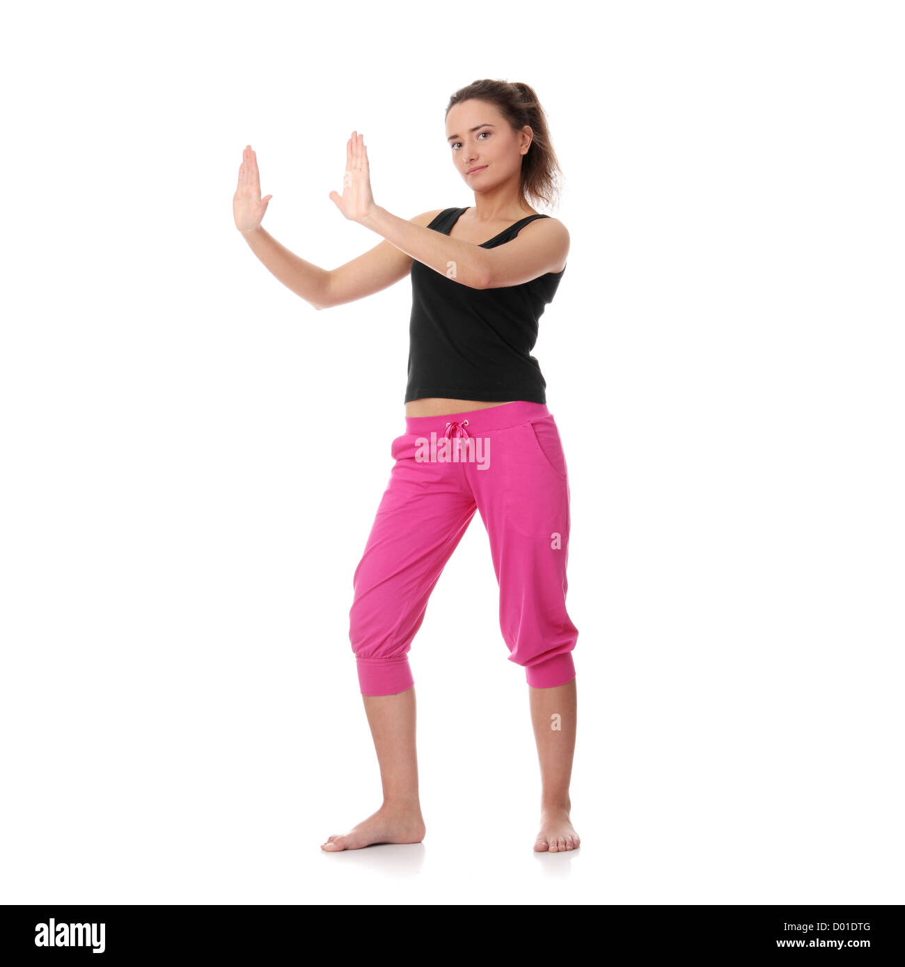 Beautiful young woman doing yoga exercise , isolated on white Stock ...