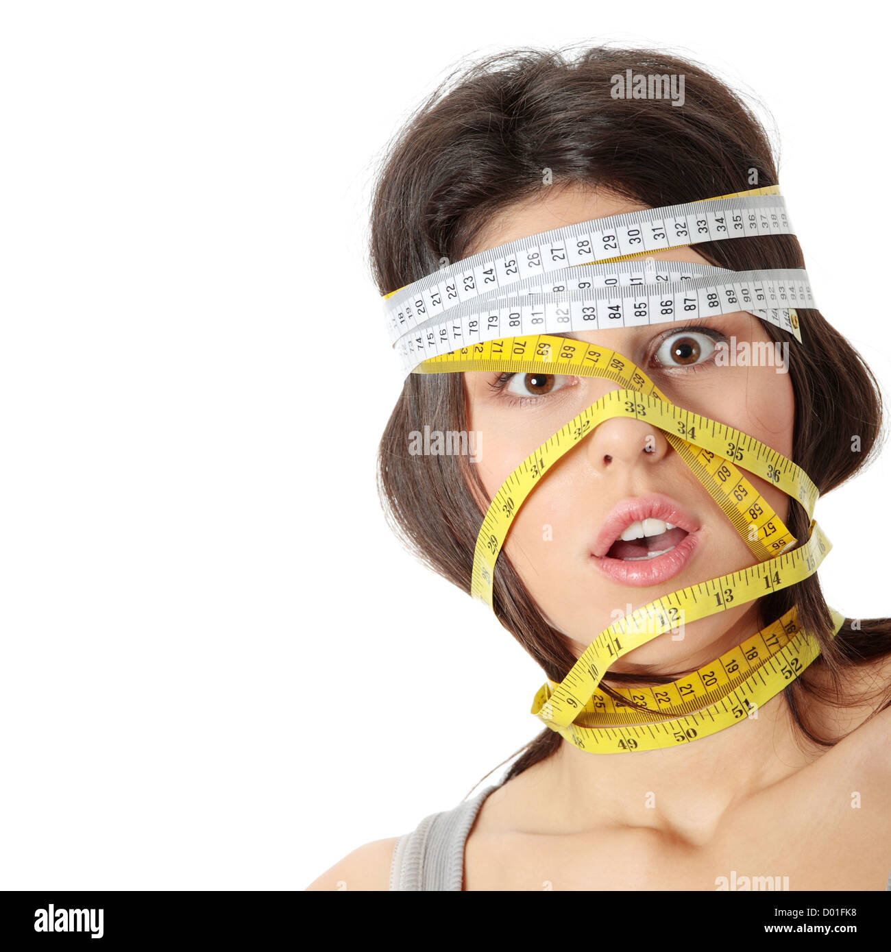 Beautiful young caucasian woman with measuring tape around her head