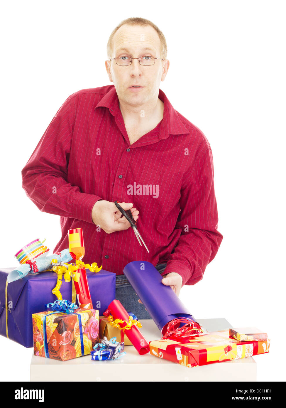 Person packaging some colorful gifts Stock Photo