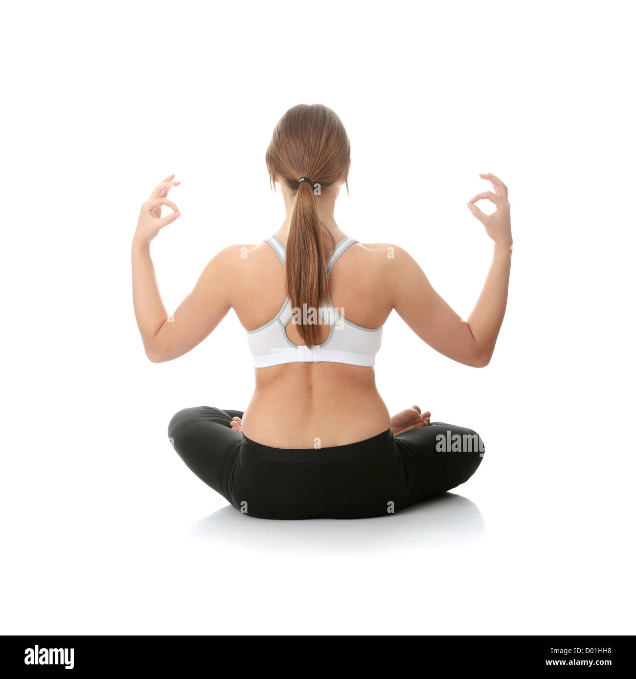 Beautiful young woman doing yoga exercise , isolated Stock Photo - Alamy