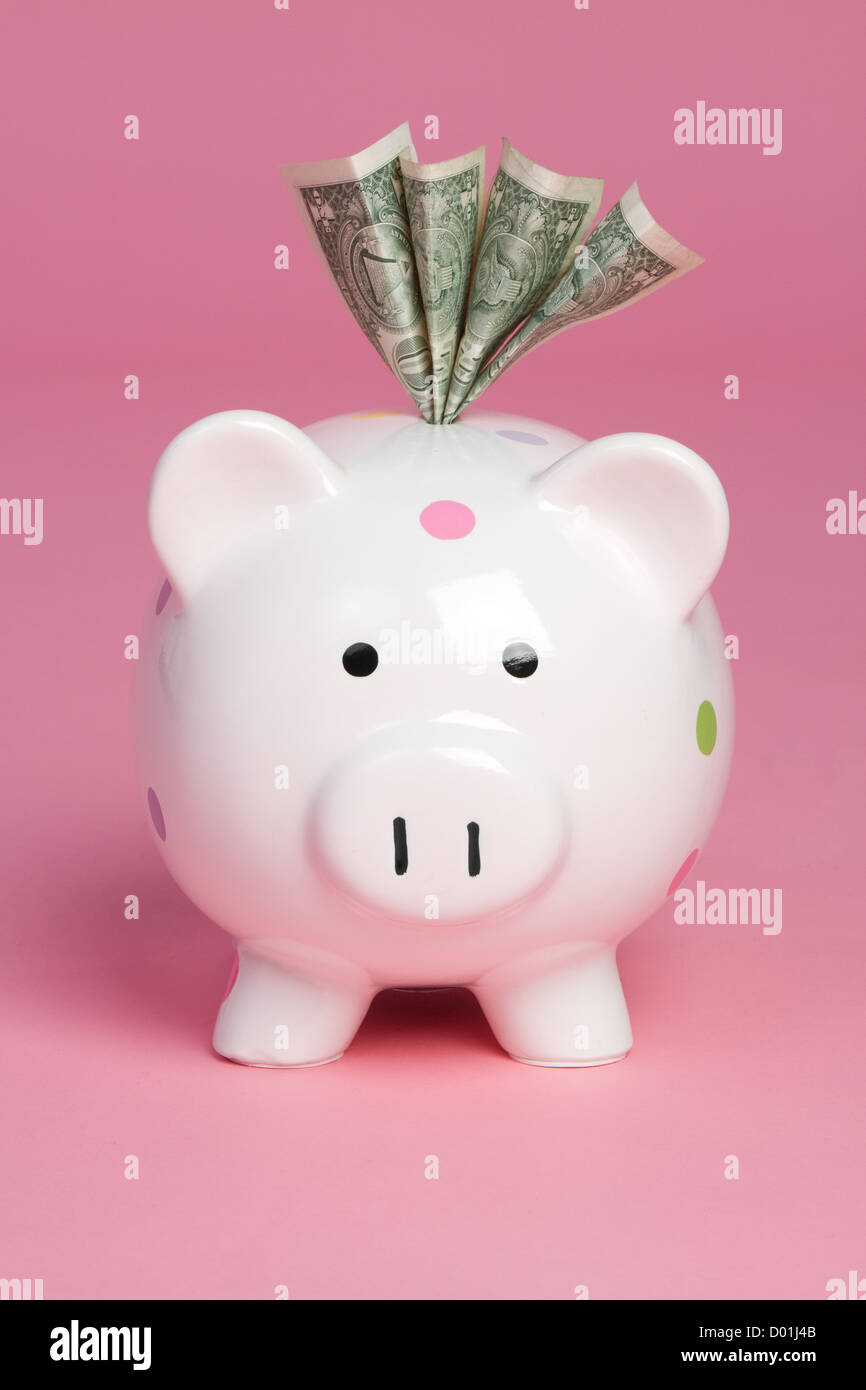 Piggy bank saving cash money Stock Photo