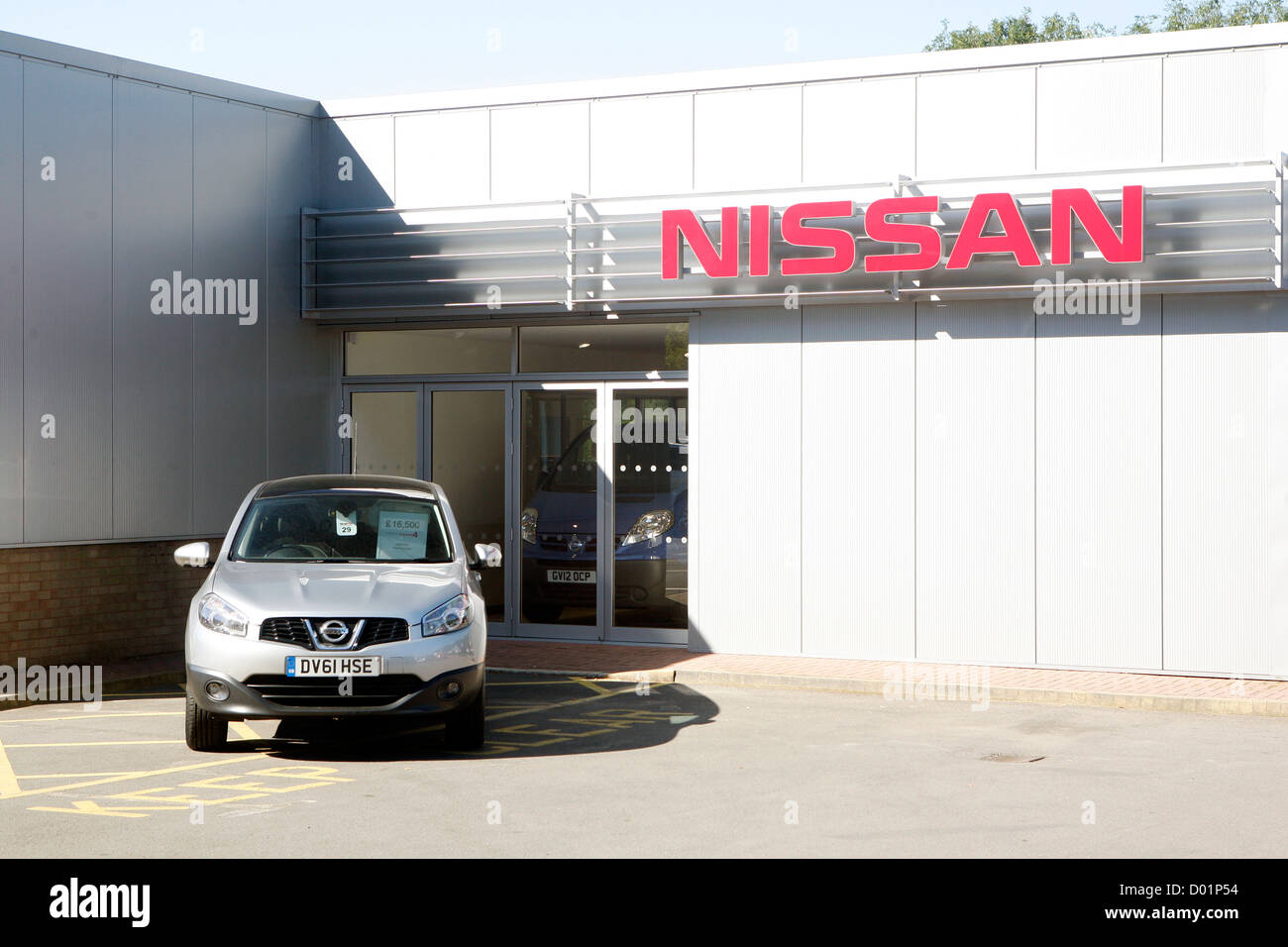 A new Nissan parked outside a Nissan car dealership in the UK Stock