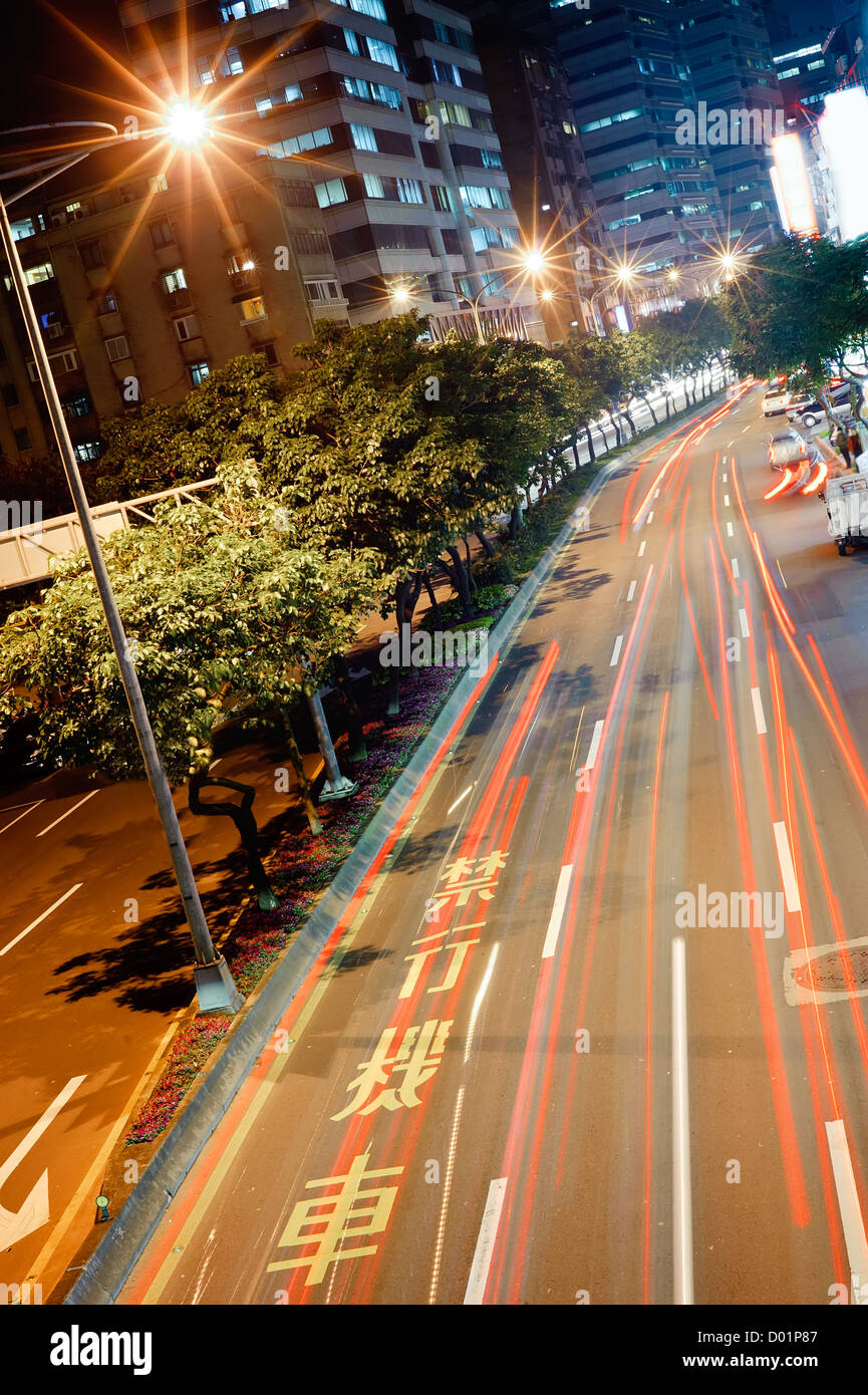 Cityscape of cars motion blurred in modern city night Stock Photo - Alamy