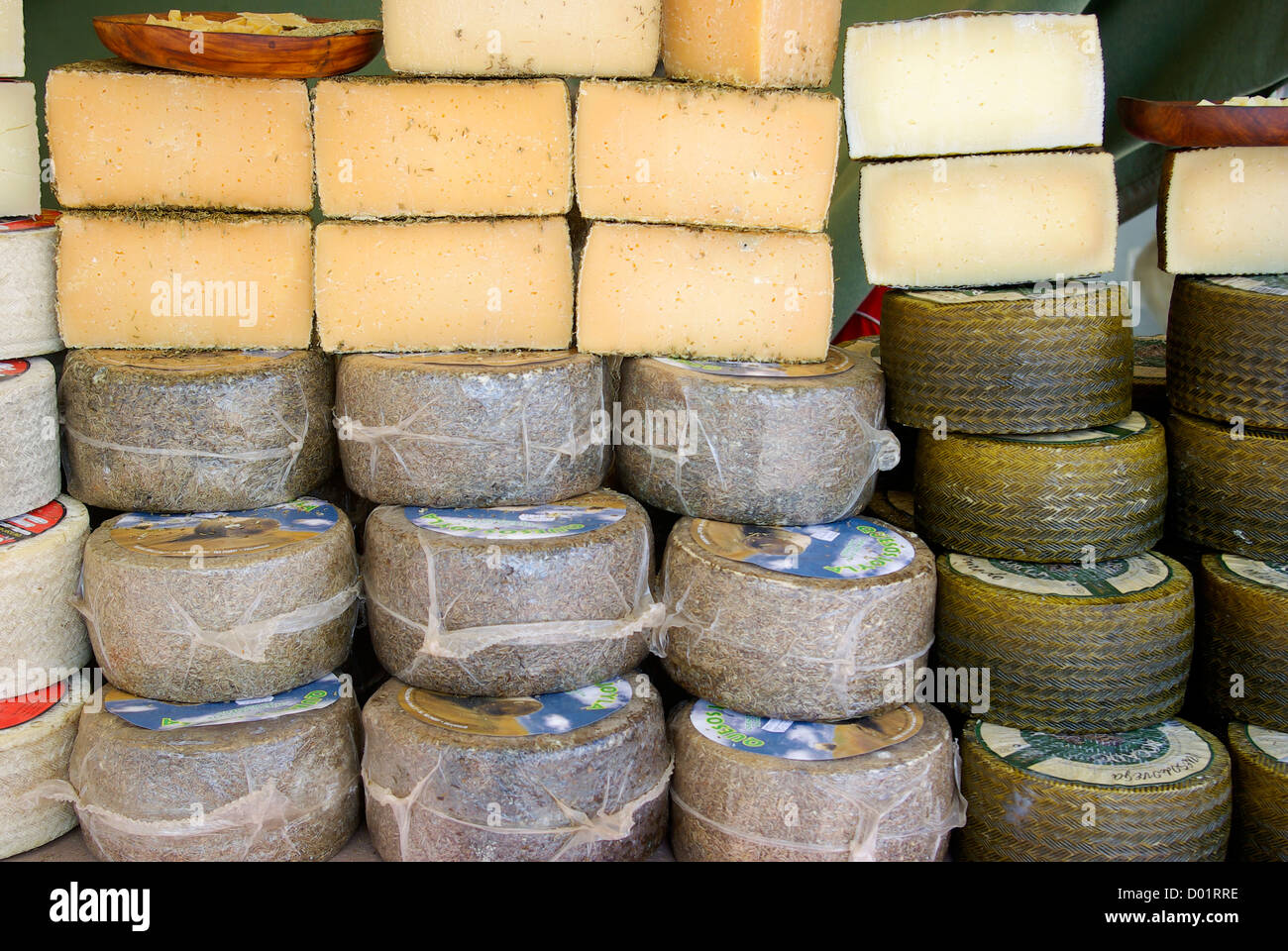 Blocks of cheese at a market in Calpe, Spain Stock Photo
