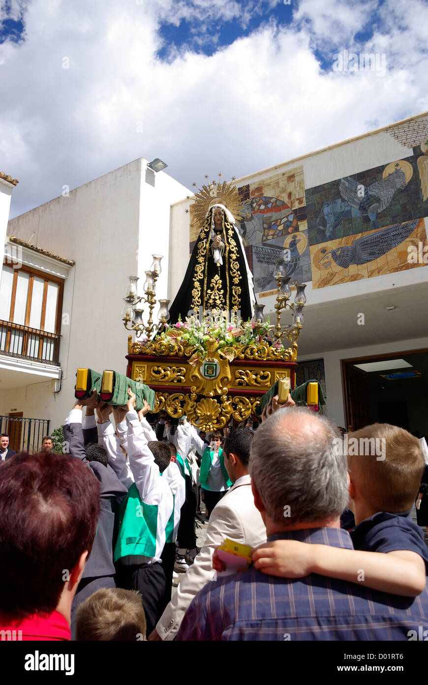 Easter Sunday procession during Semana Santa in Calpe, Spain. An effigy of the virgin Mary is hoisted into the church Stock Photo