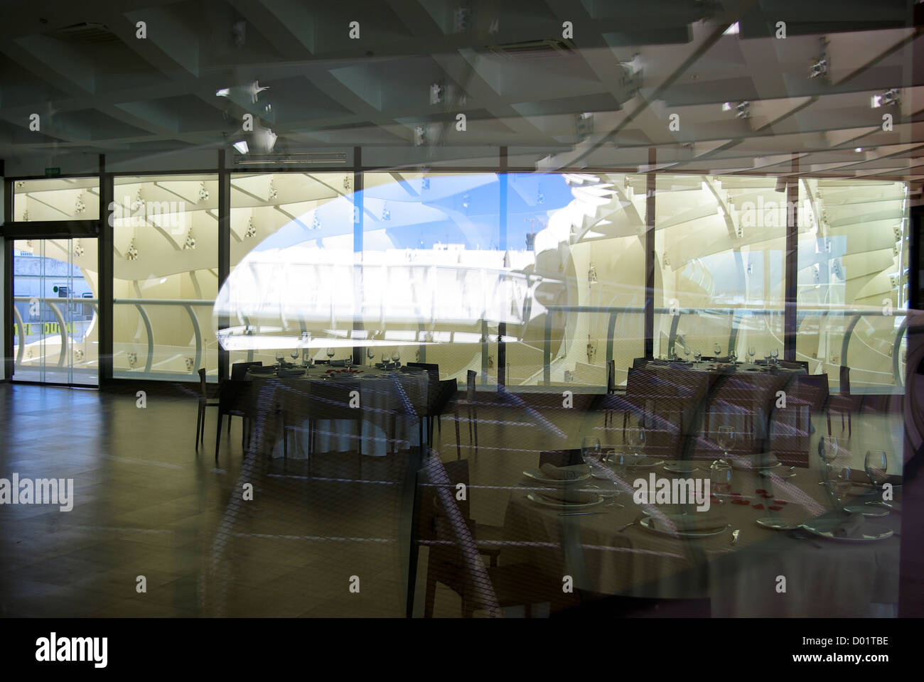 View of restaurant with reflections on the viewing deck of the Metropol Parasol in Seville, Andalusia, Spain Stock Photo