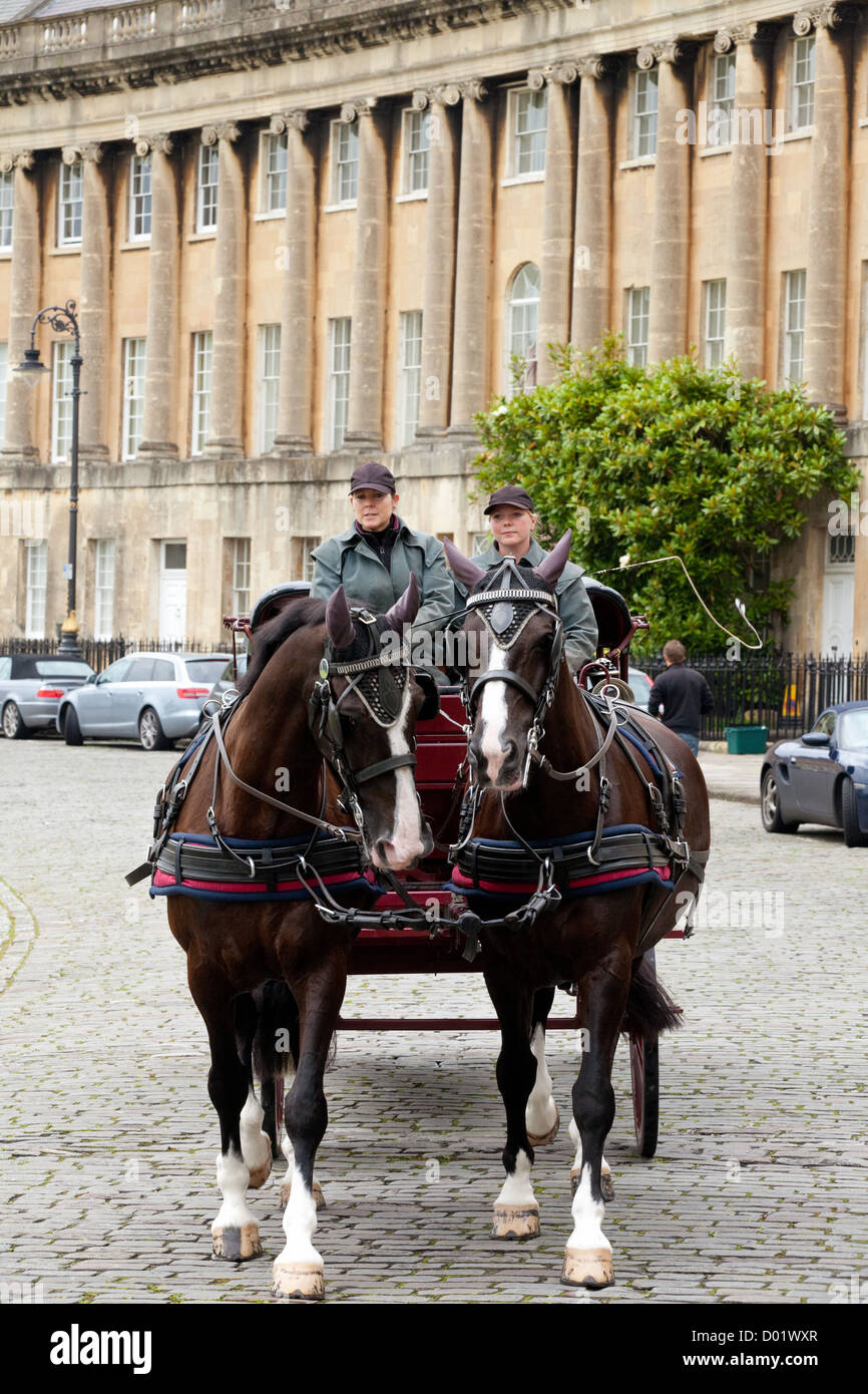 Royal crescent Bath UK; Traditional horse and carriage at the Royal Crescent georgian houses, Bath Somerset UK Stock Photo