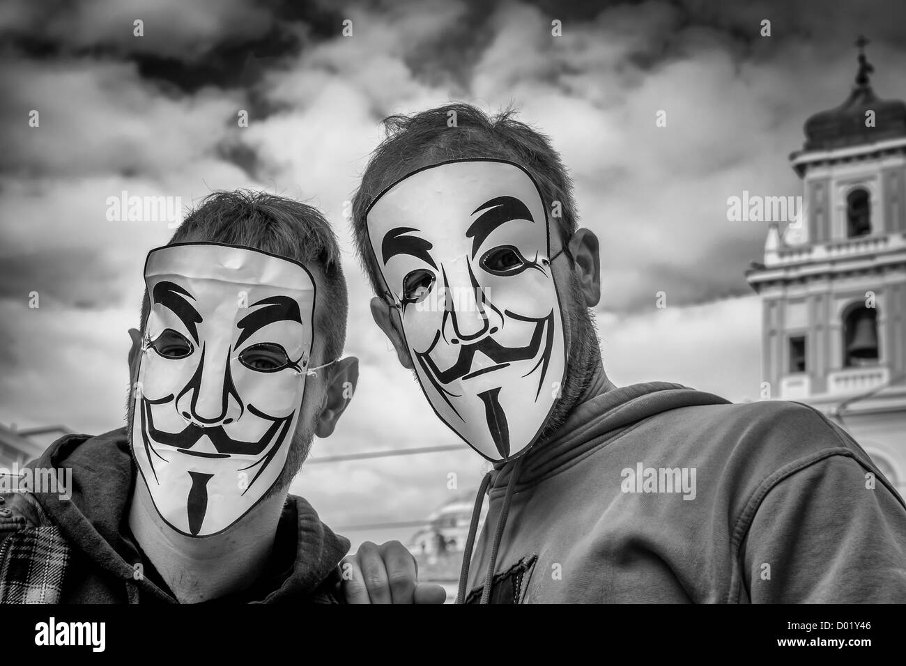 Italian demonstrates wear Guy Fawkes masks during a demonstration against austerity masseurs in Parma, Italy Stock Photo