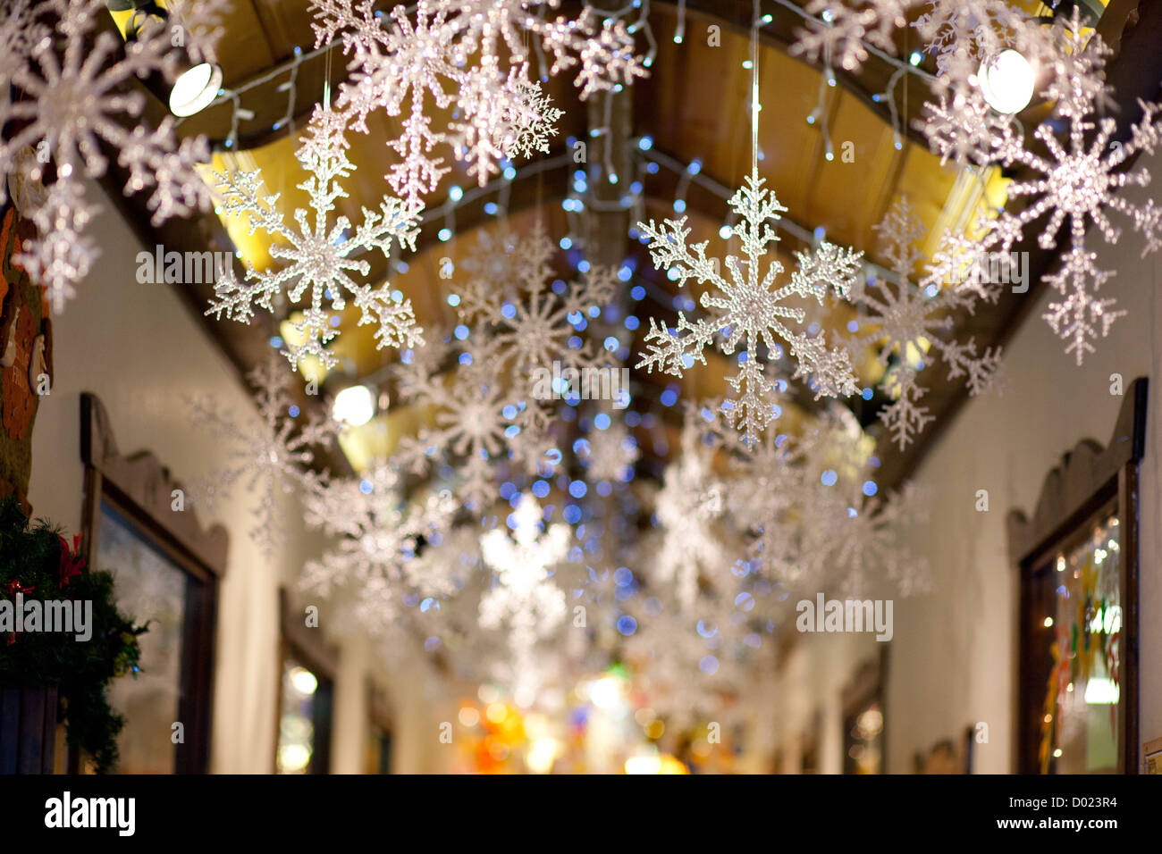 Plastic snowflake decorations in a hallway. Stock Photo
