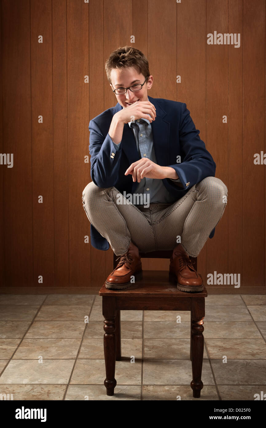 Young guy and a chair hi-res stock photography and images - Alamy
