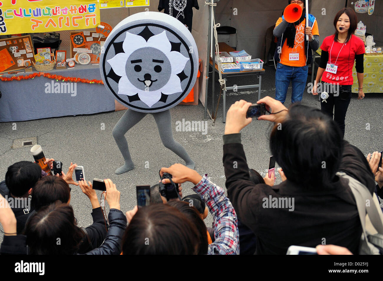 November 11th, 2012 : Tokyo, Japan - People took pictures of Nishikokun, a character that represented Nishikokubunji, Tokyo, at Kizukinasai, a festival that Tsukiji Honganji Temple hosted to celebrate its restoration of the main building that had been a Registered Tangible Cultural Property since 2011, at Chuo, Tokyo, Japan on November 11, 2012.(Photo by Koichiro Suzuki/AFLO) Stock Photo