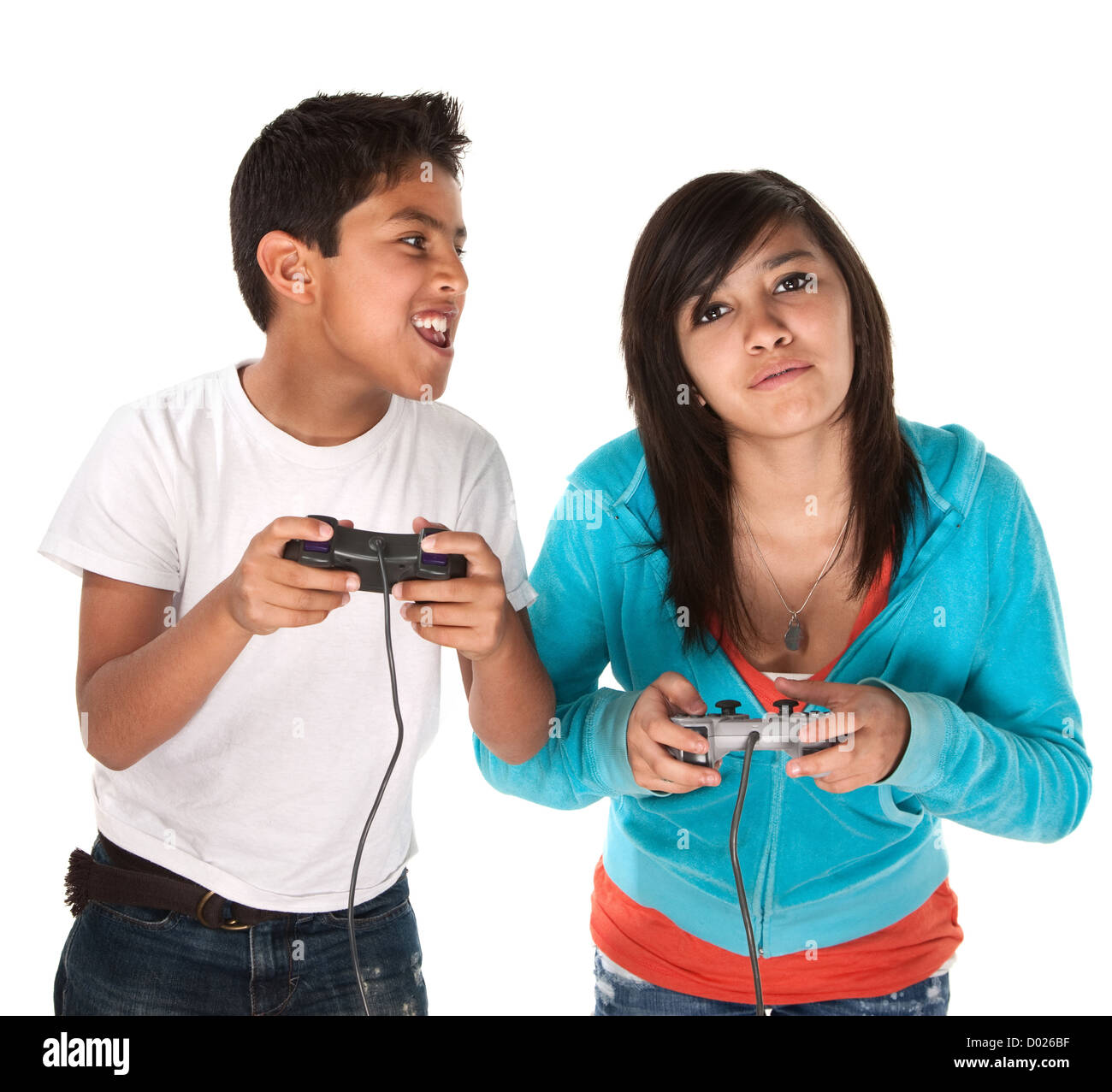 Two young cute Hispanic kids playing video games Stock Photo