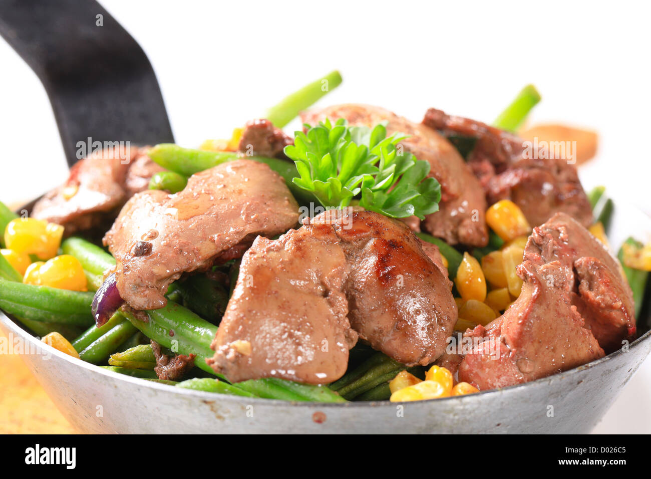 Panfried chicken livers with green beans and sweetcorn Stock Photo Alamy