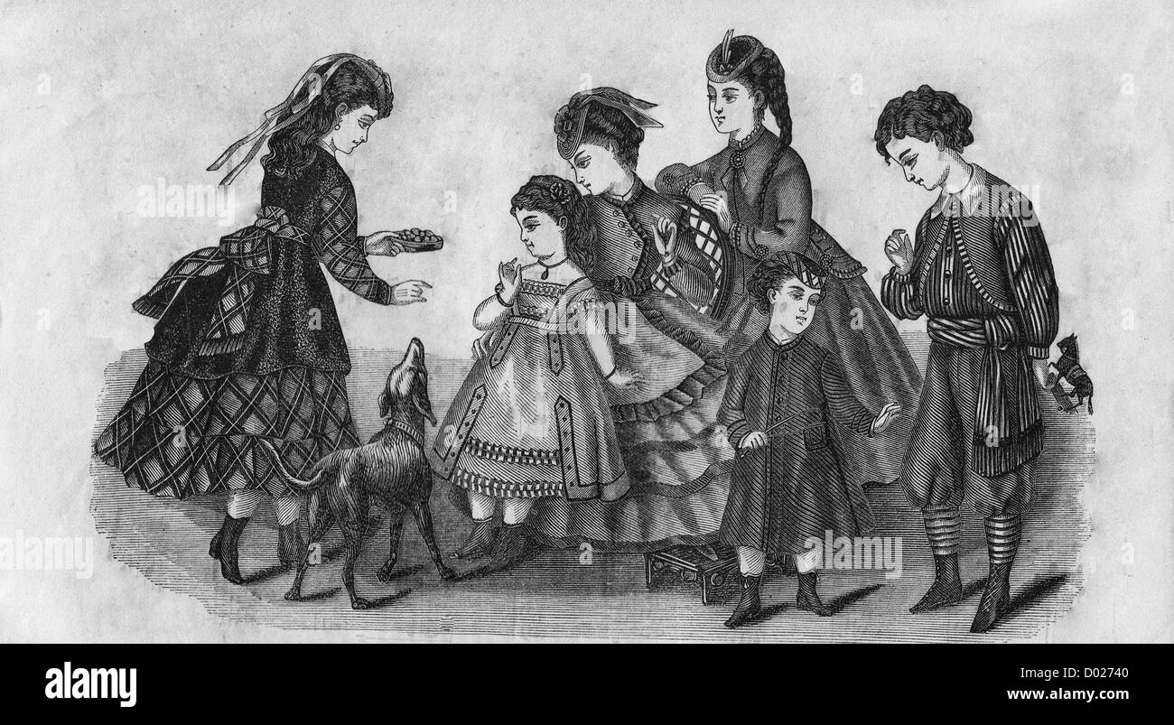 Victorian era girls dresses with a dog Stock Photo
