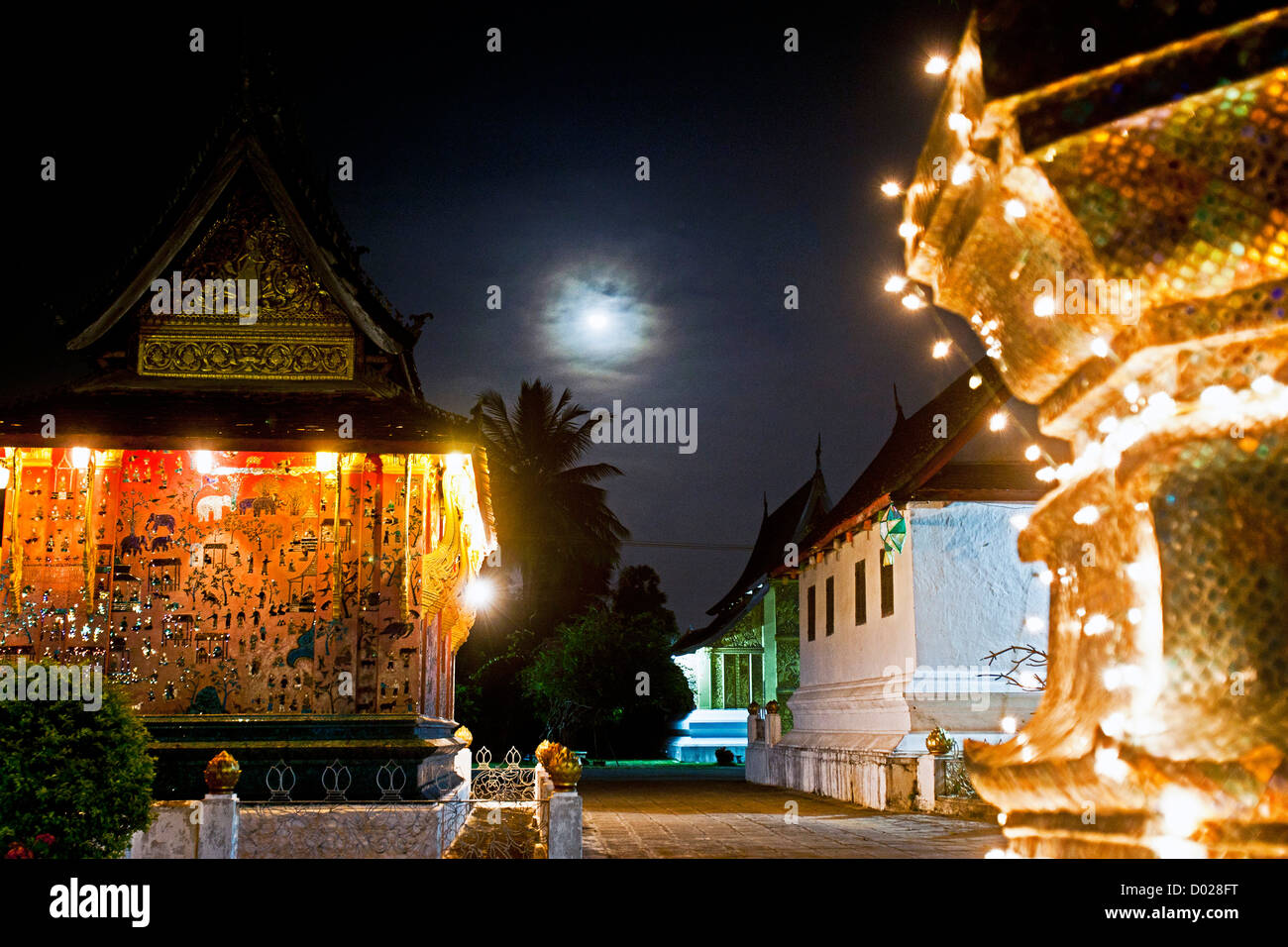 Wat Xieng Thong lit up at night Luang Prabang Laos PDR Stock Photo