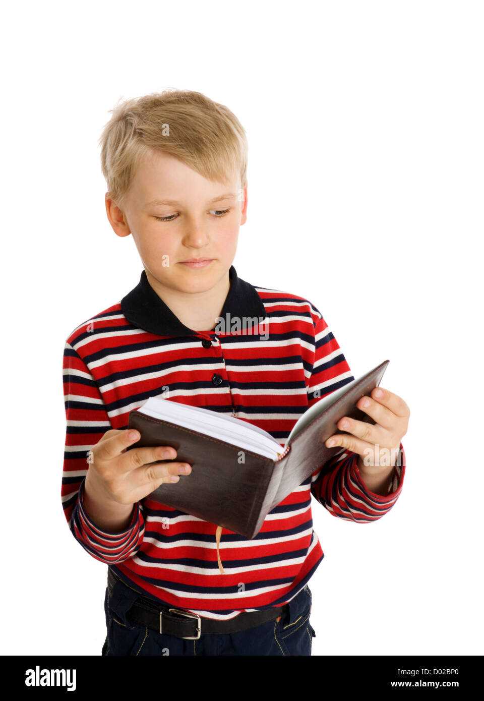 schoolboy looking at book isolated on white Stock Photo