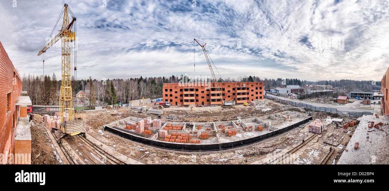 construction site building winter crane progress Stock Photo