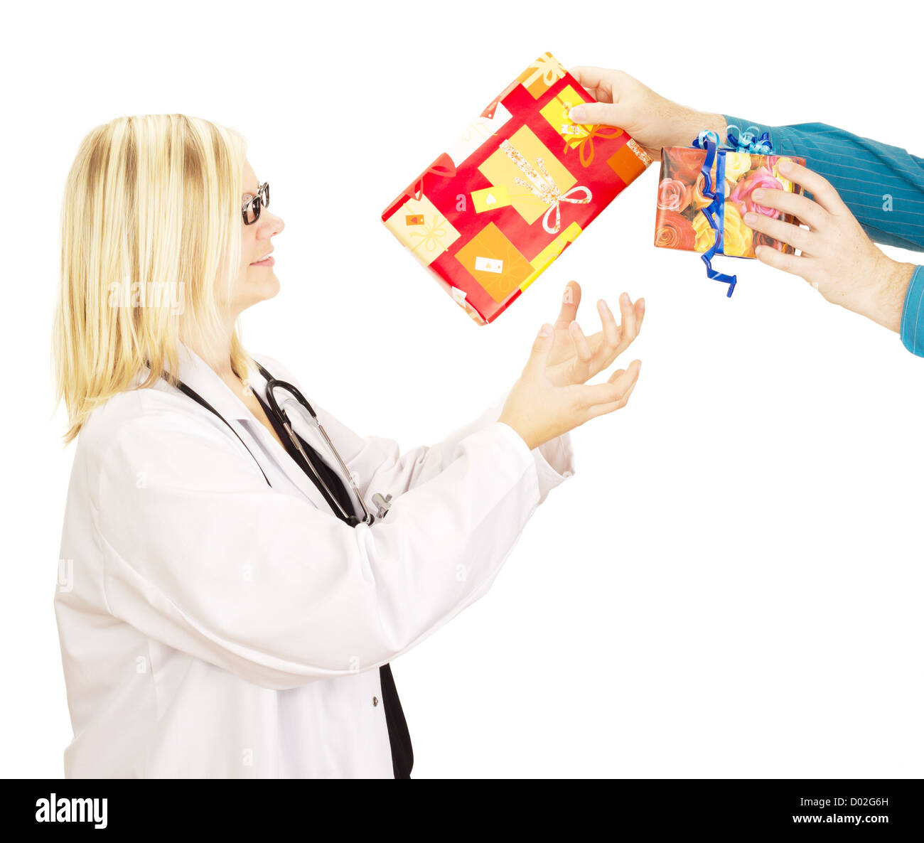 Medical doctor grabbing two gifts Stock Photo Alamy