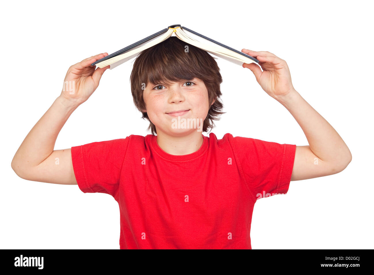 Student child with a book over his head isolated over white background ...