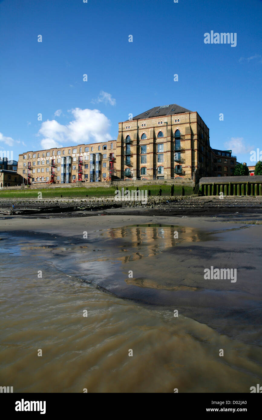Columbia Wharf seen from the beach of the River Thames at low tide, Rotherhithe, London, UK Stock Photo