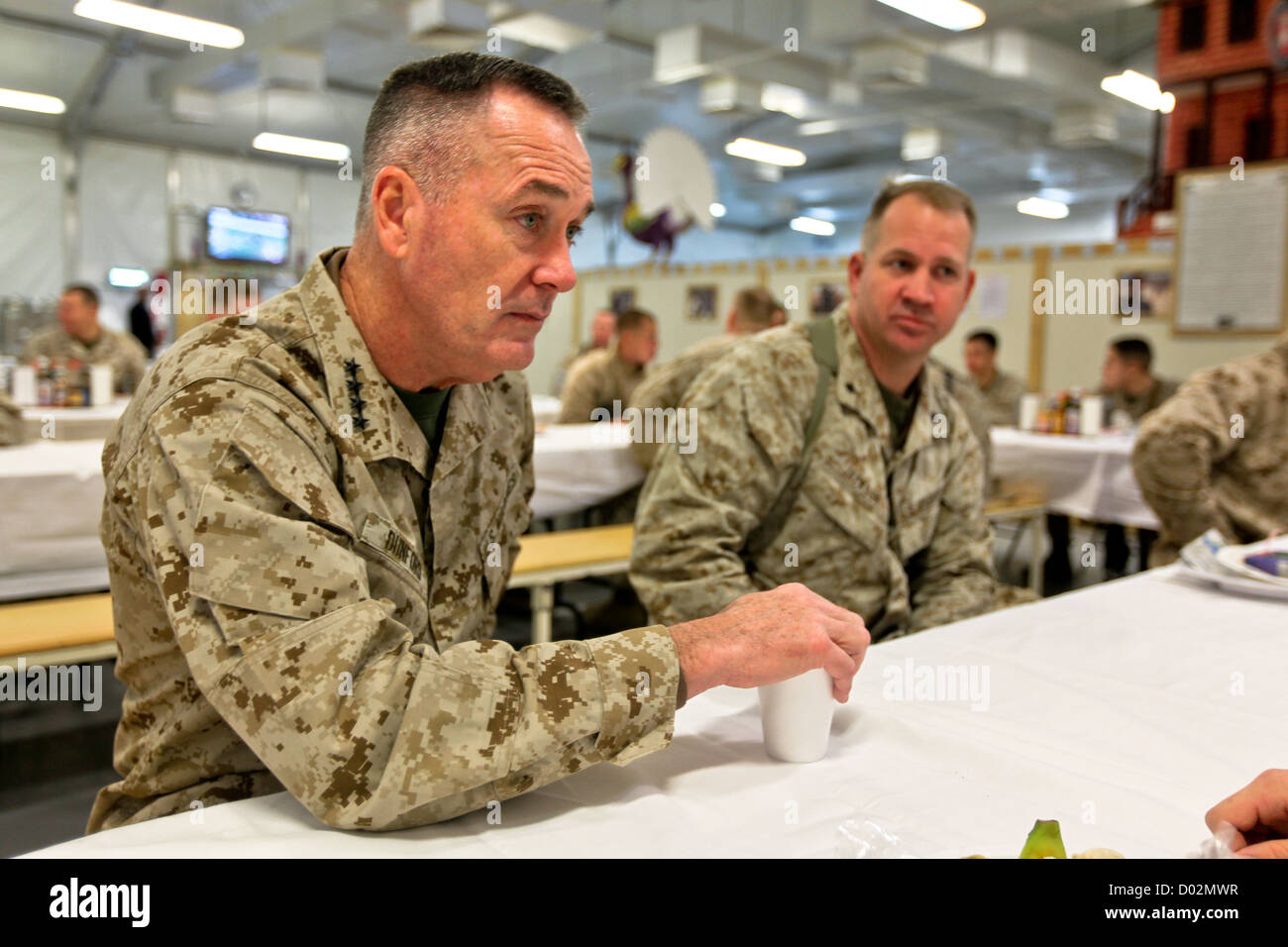 US Marine General Joseph Dunford, assistant commandant of the Marine Corps, has breakfast with Marines during a Christmas Day visit December 25, 2011 in Helmand, Afghanistan. Stock Photo