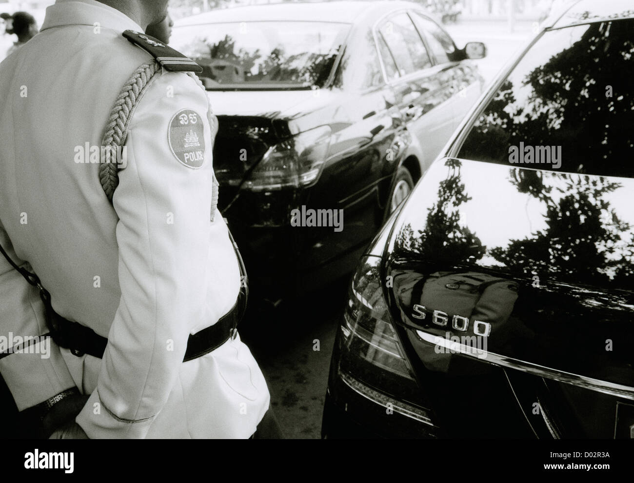 Travel Photography - Police guard the Cambodian King's car in Phnom Penh in Cambodia Indochina in Southeast Asia Far East. Reportage Photojournalism Stock Photo