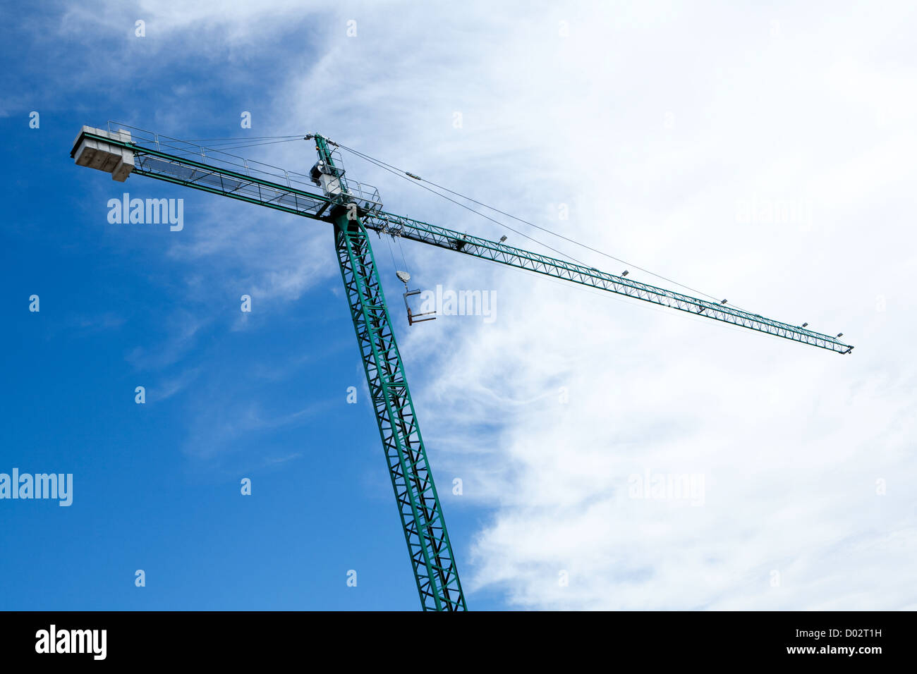 Huge construction crane with cloudy sky background Stock Photo - Alamy