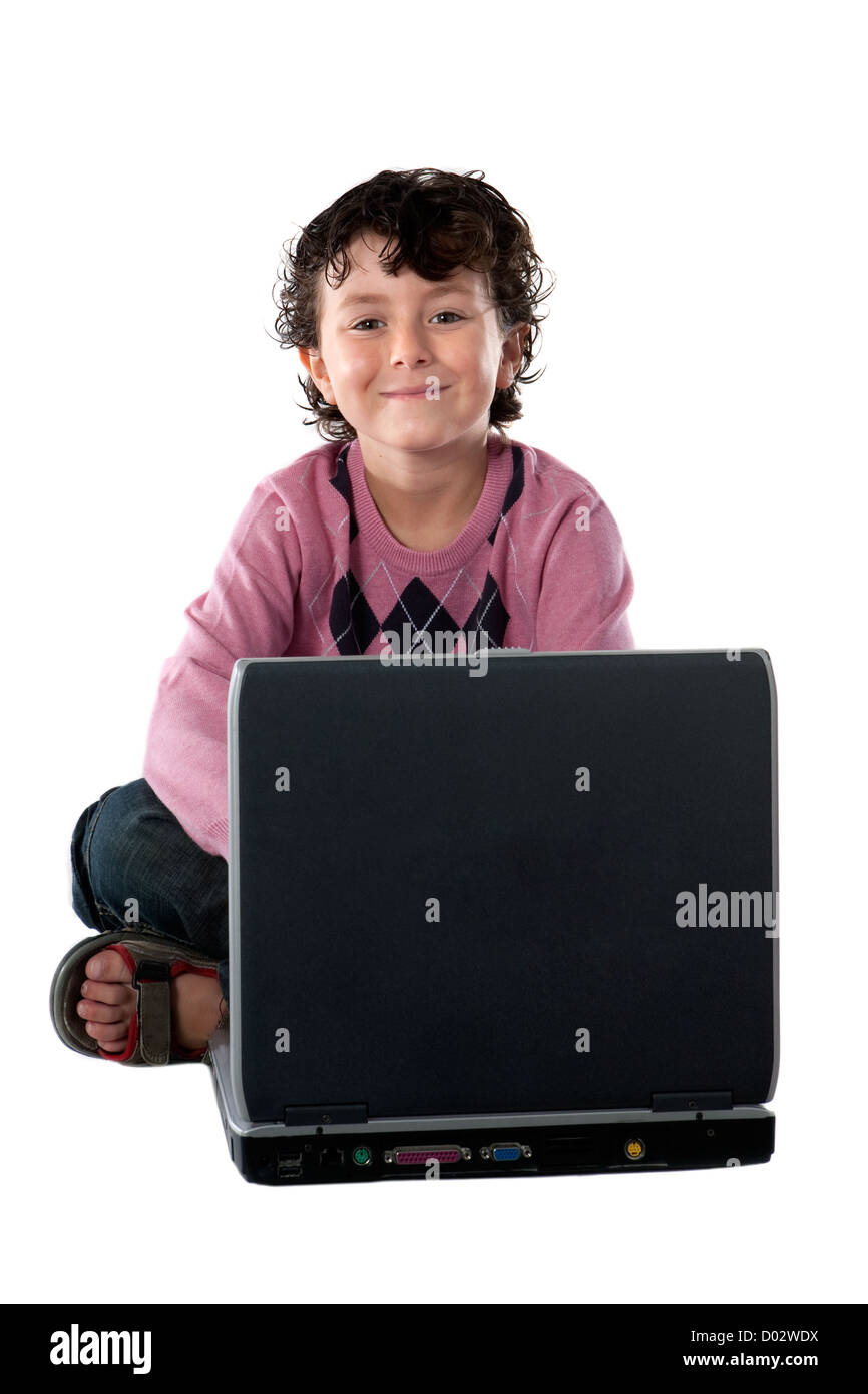Happy child sitting with a laptop on a over white background Stock ...